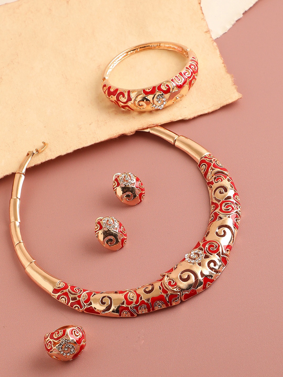 

SOHI Women Gold-Plated & Toned Red Artificial Stones Studded Jewellery Set