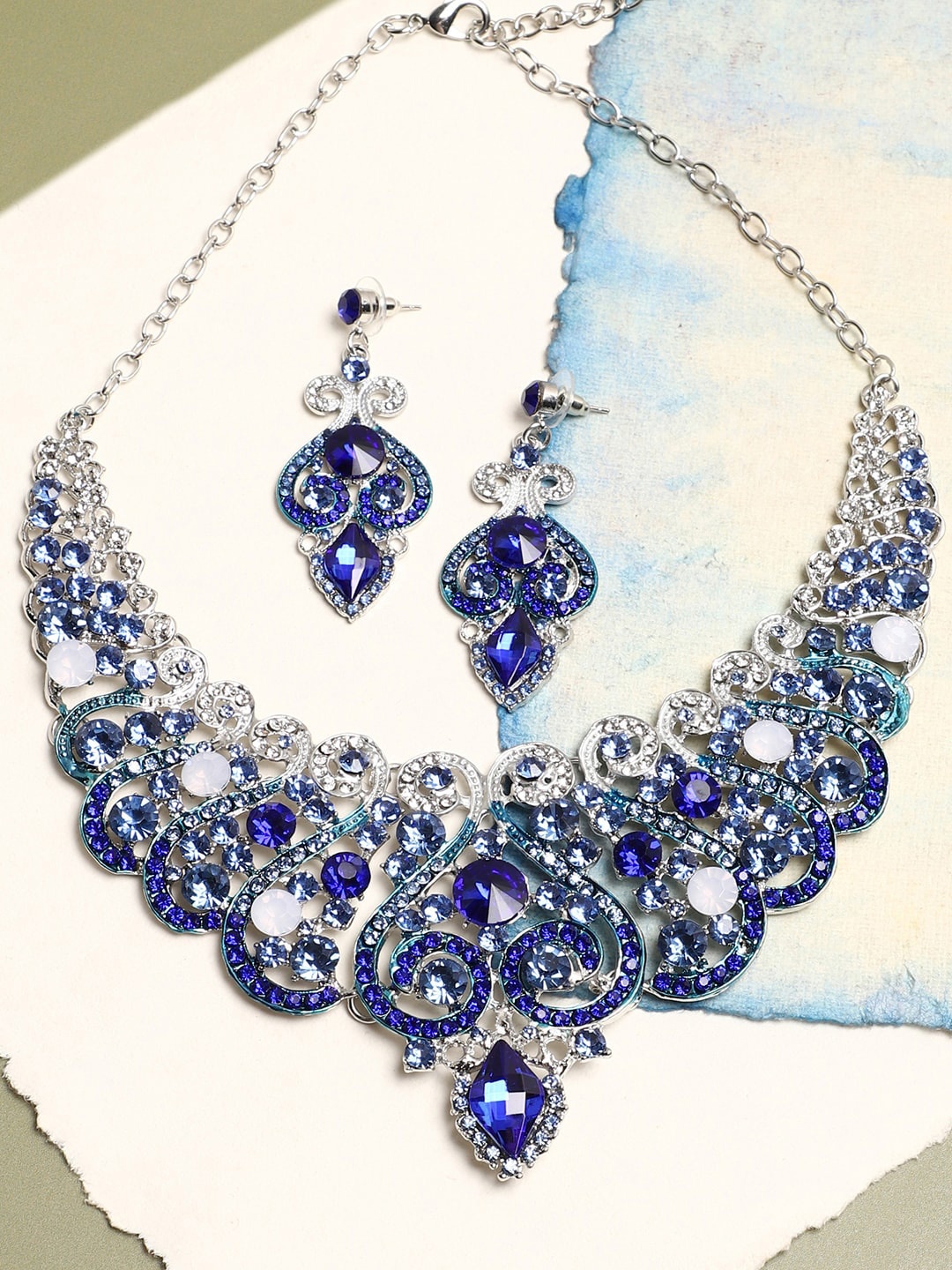 

SOHI Women Silver-Plated Blue Stone Studded Jewellery Set
