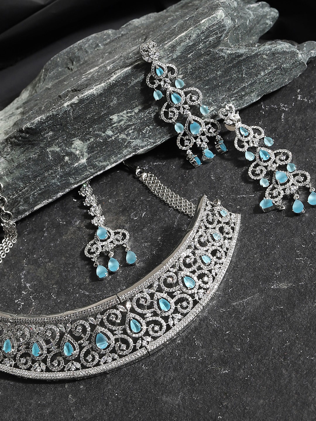 

SOHI Women Silver-Plated White & Blue AD-Studded Jewellery Set