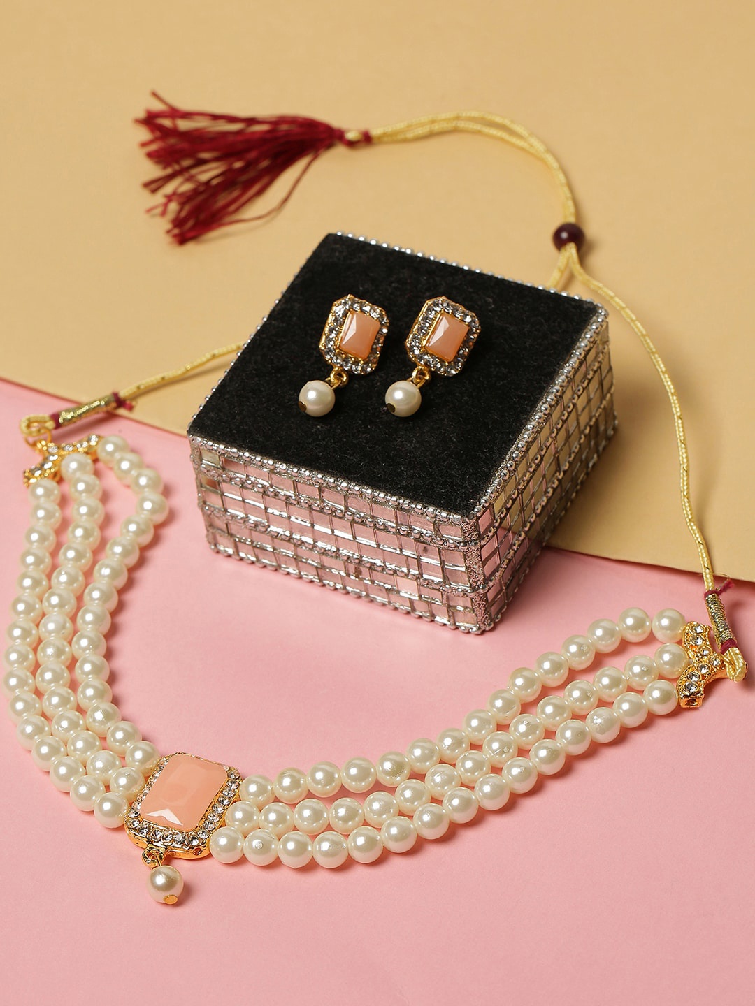 

SOHI Women Gold-Plated White & Orange Stone-Studded & Beaded Jewellery Set