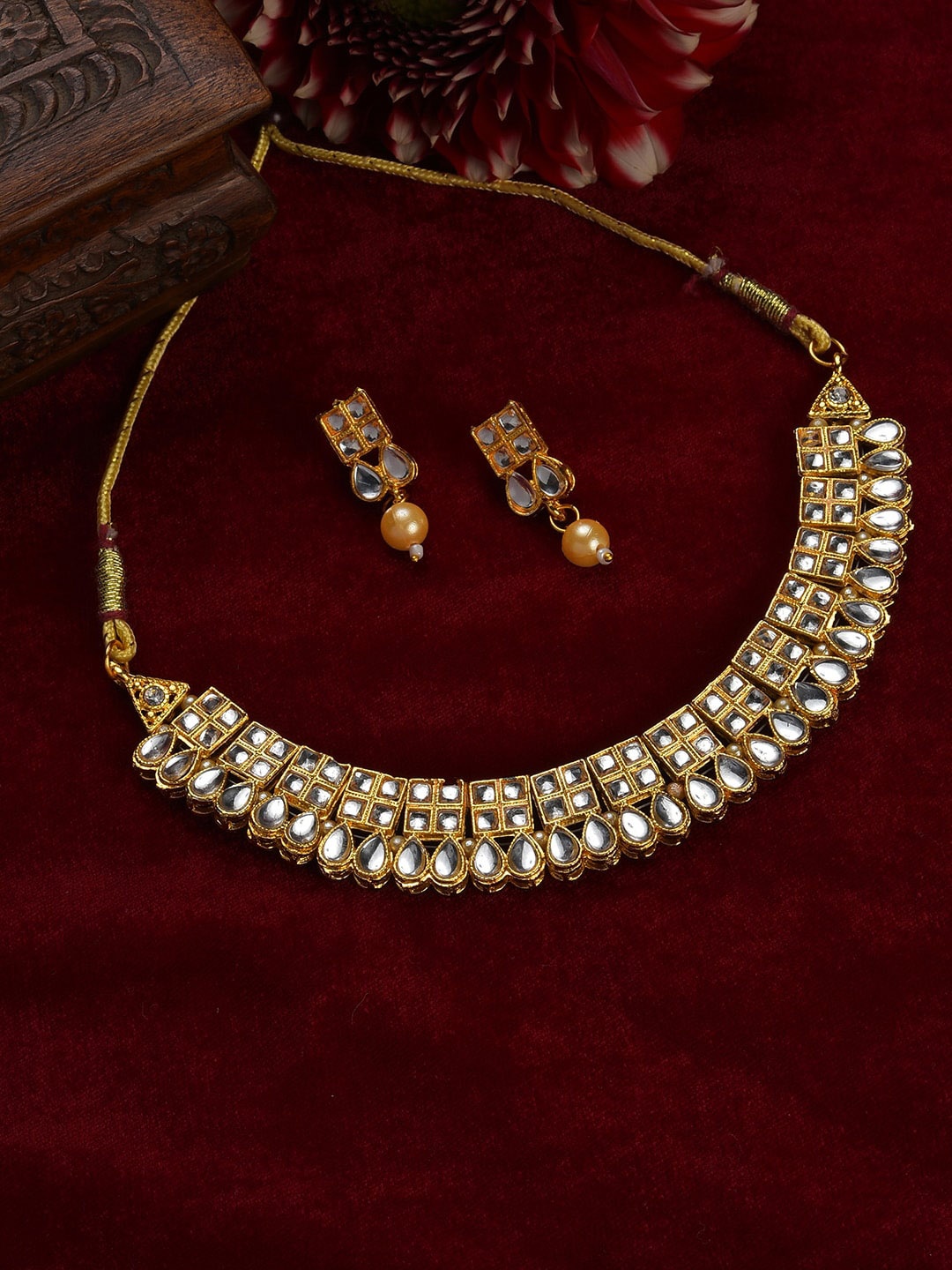 

SOHI Women Gold-Plated White & Yellow Stone Studded & Beaded Jewellery Set