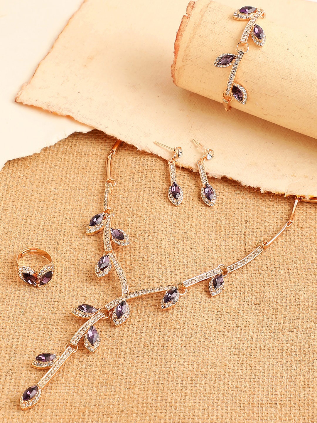 

SOHI Women Gold-Plated & Toned Lavender Artificial Stones Studded Jewellery Set