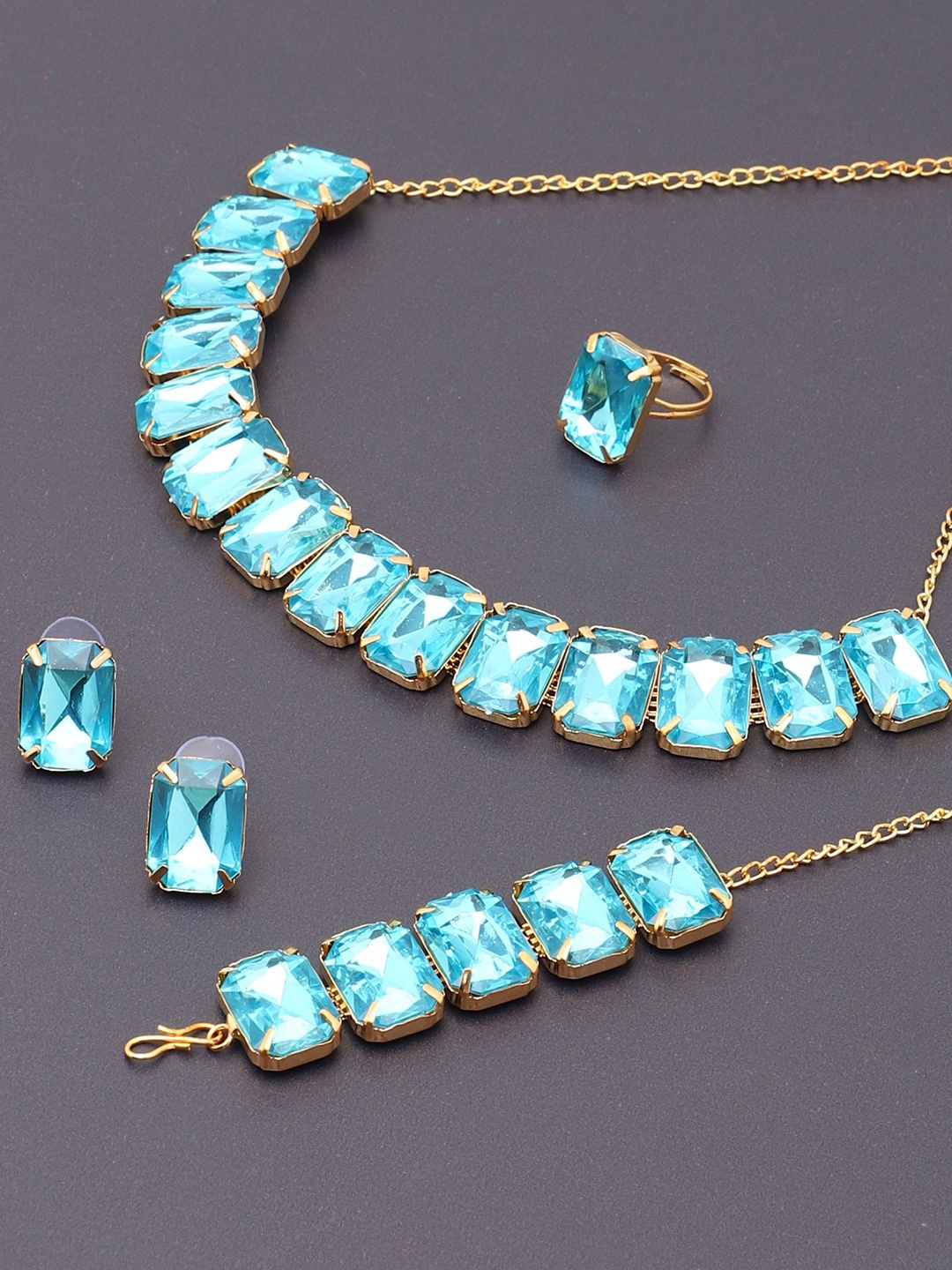 

SOHI Women Gold-Plated & Blue Artificial Stones Studded Jewellery Set