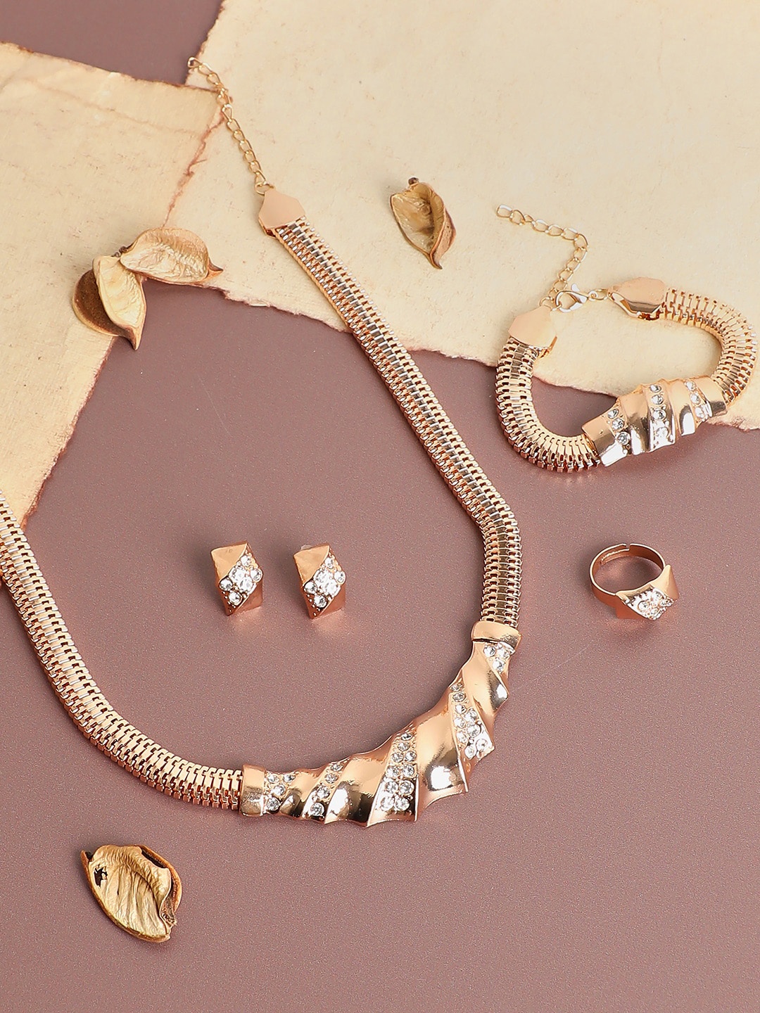 

SOHI Women Gold-Plated & Toned White Artificial Stones Studded Jewellery Set