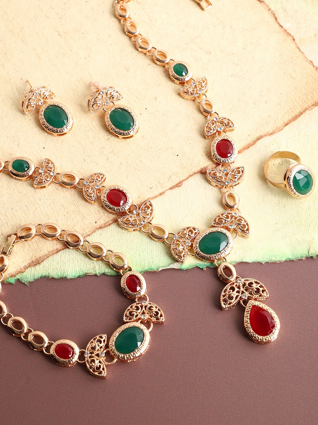 

SOHI Gold-Plated White & Green Stone Studded Jewellery Set