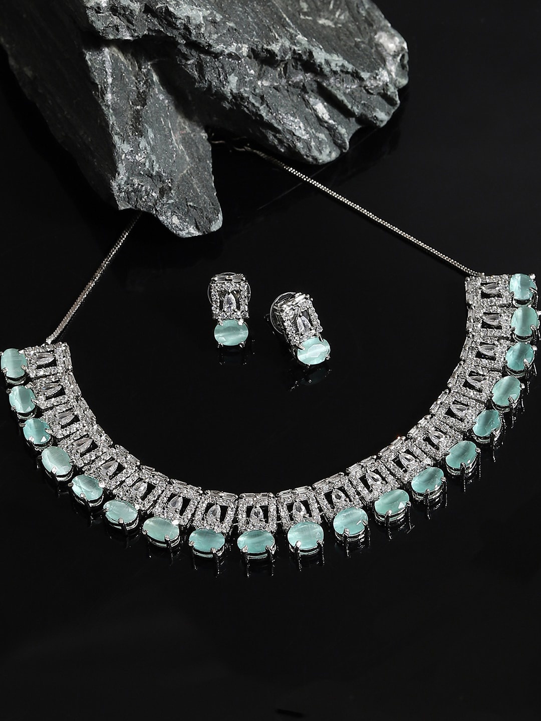 

SOHI Women Silver-Plated & Teal Blue AD Studded Jewellery Set