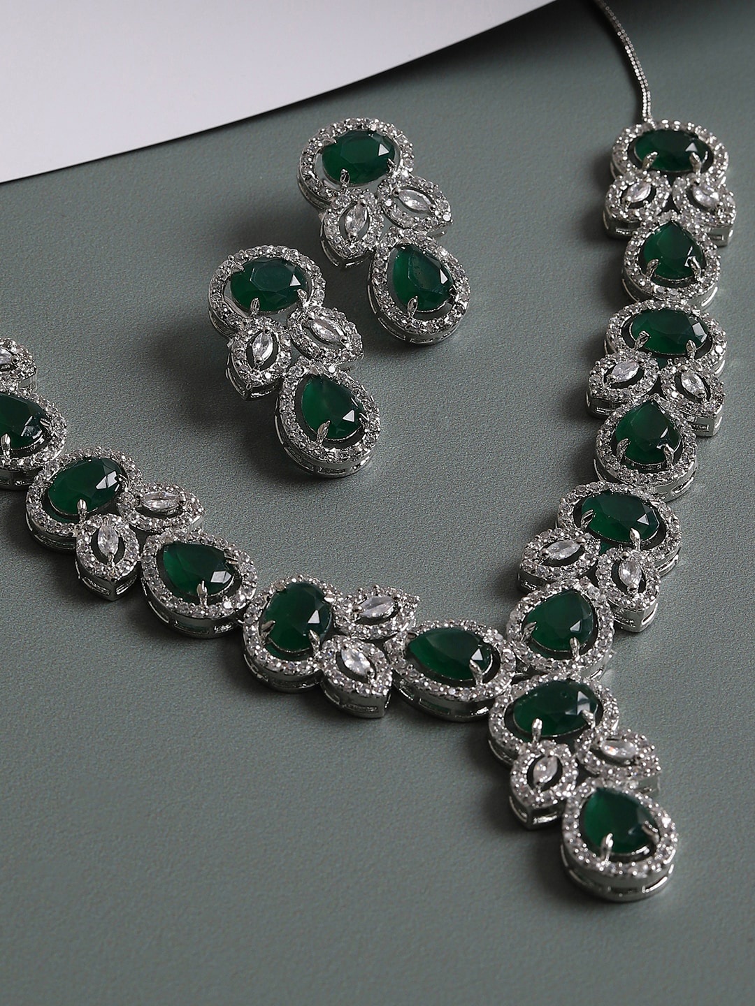 

SOHI Women Silver-Plated White & Green AD-Studded Jewellery Set
