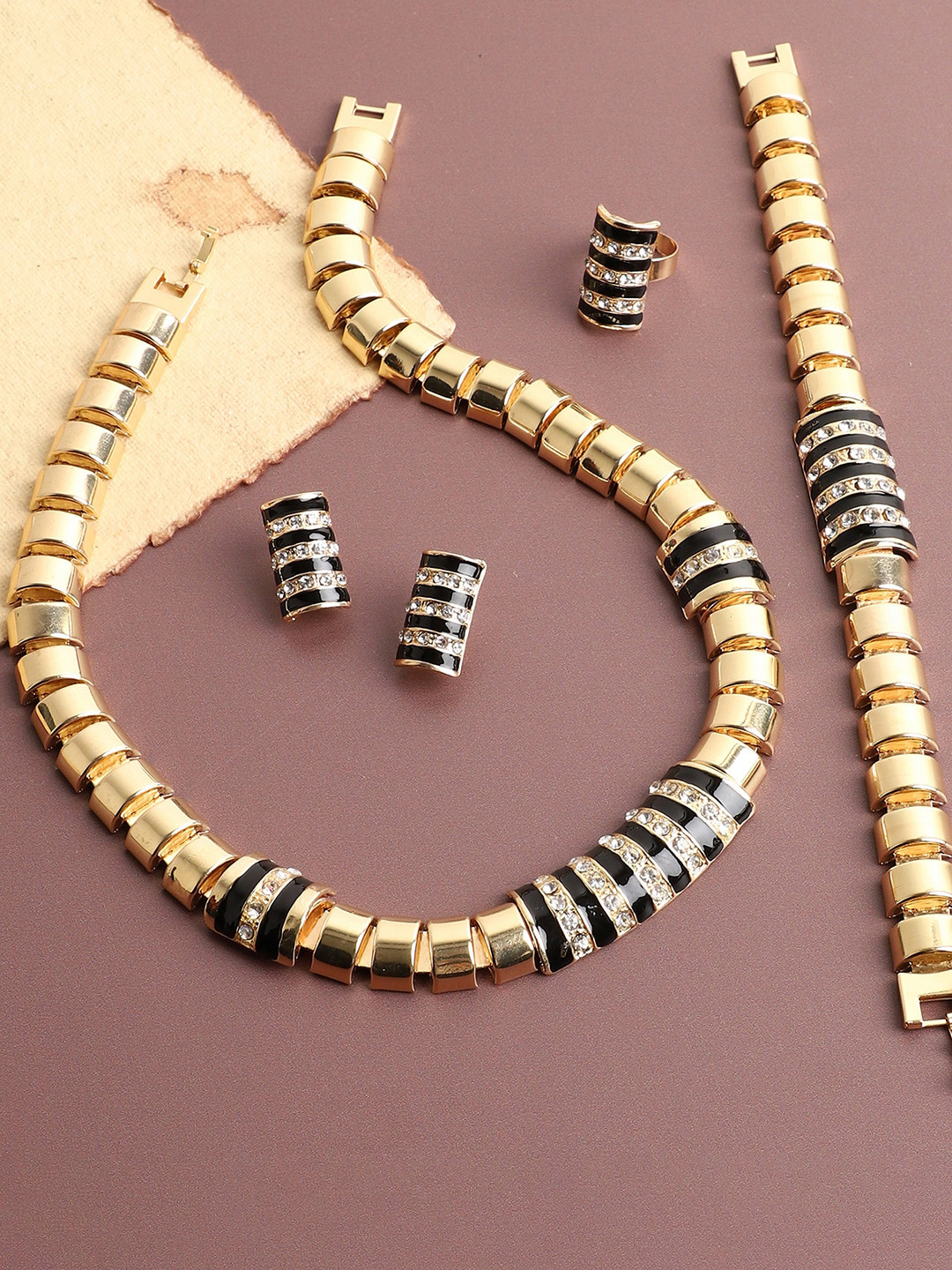 

SOHI Women Gold-Plated White & Black Stone-Studded Jewellery Set