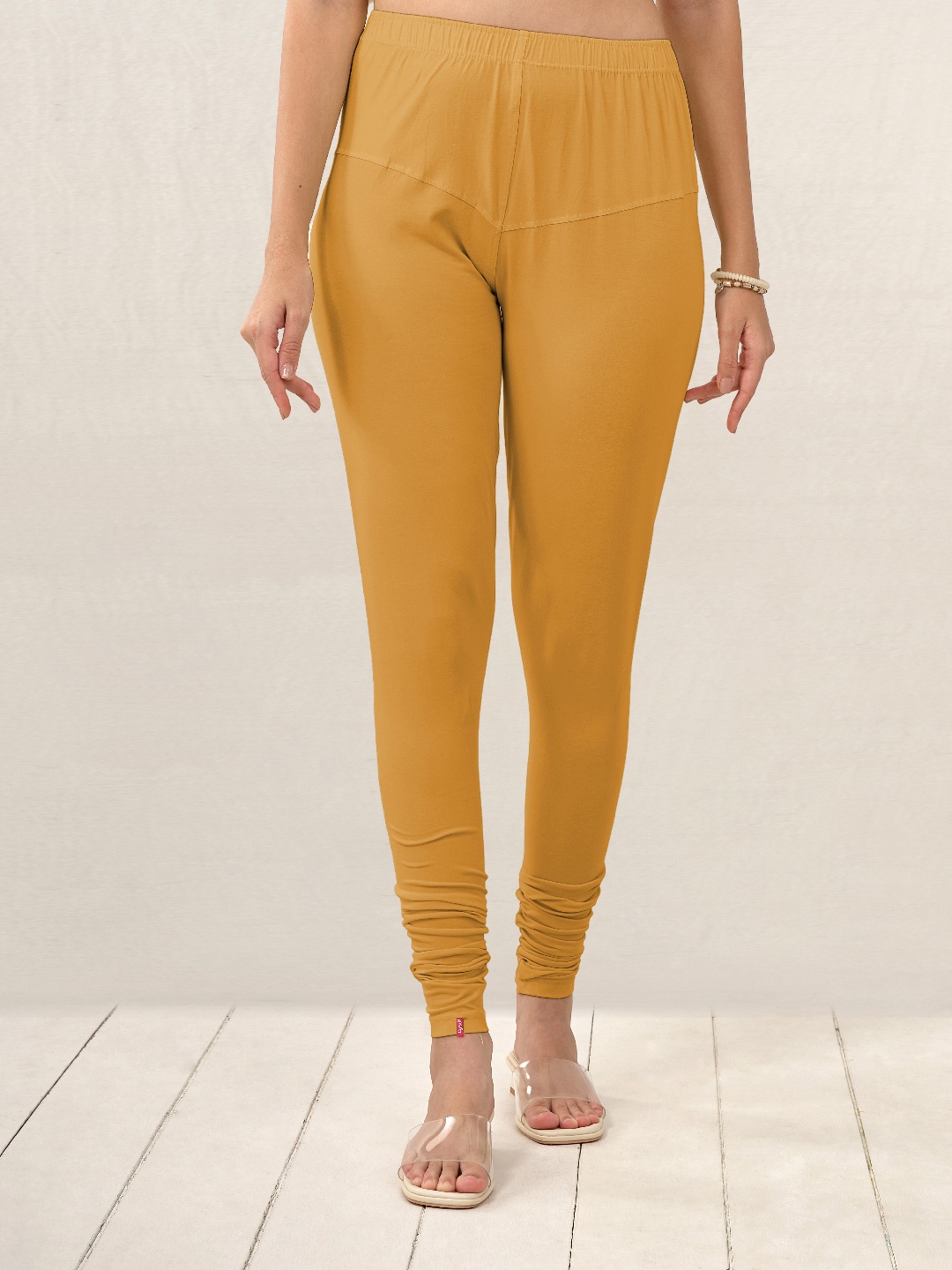 

LYRA Women Golden Yellow Solid Churidar Length Leggings, Mustard