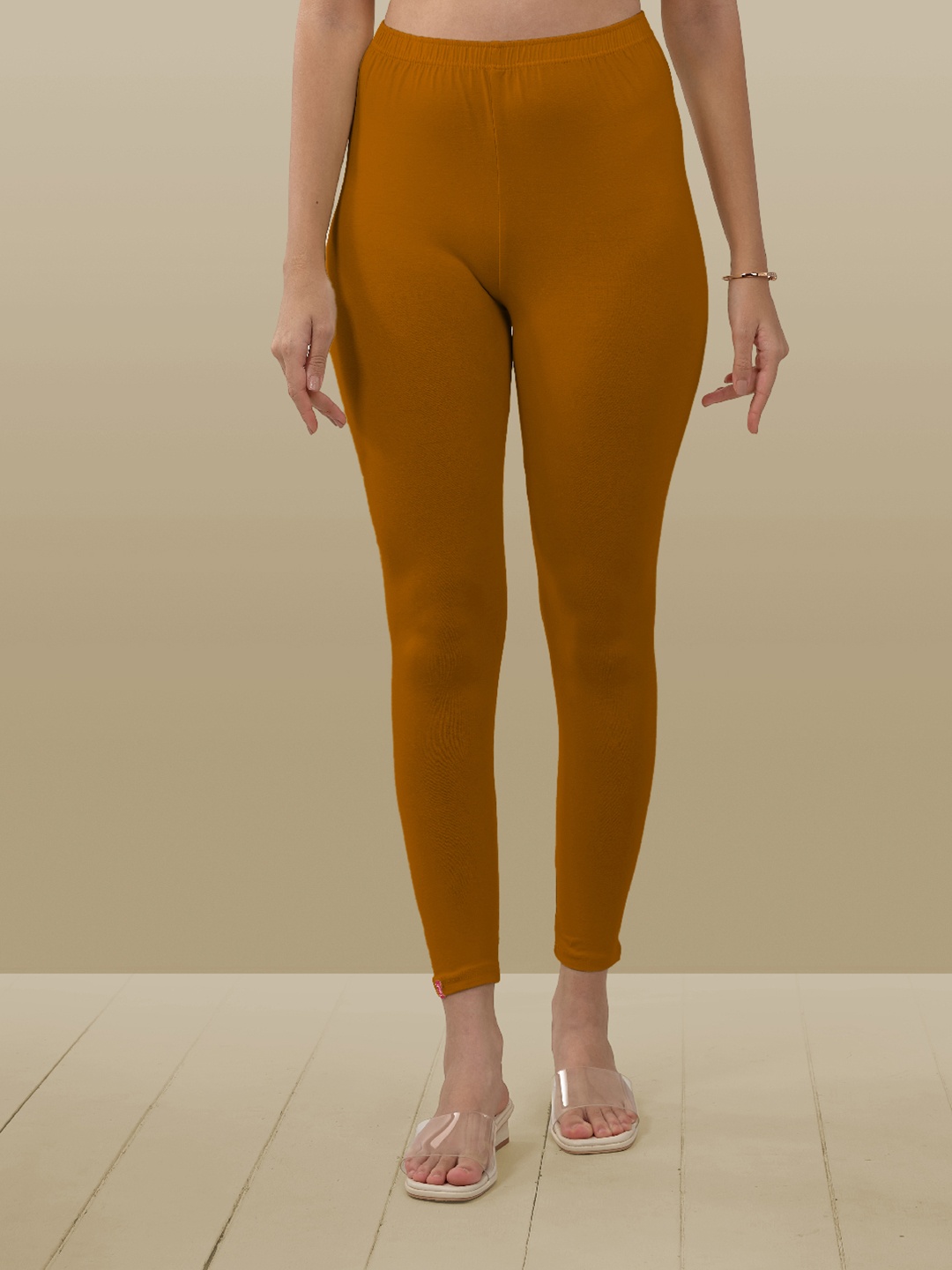 

LYRA Women Brown Solid Ankle-Length Leggings, Orange