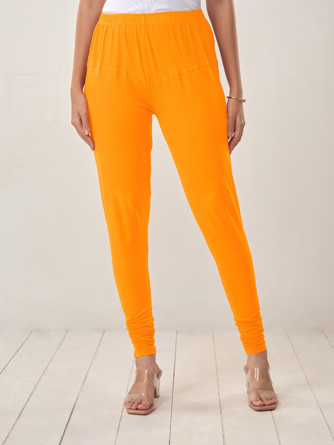 

LYRA Women Orange Solid Churidar-Length Leggings