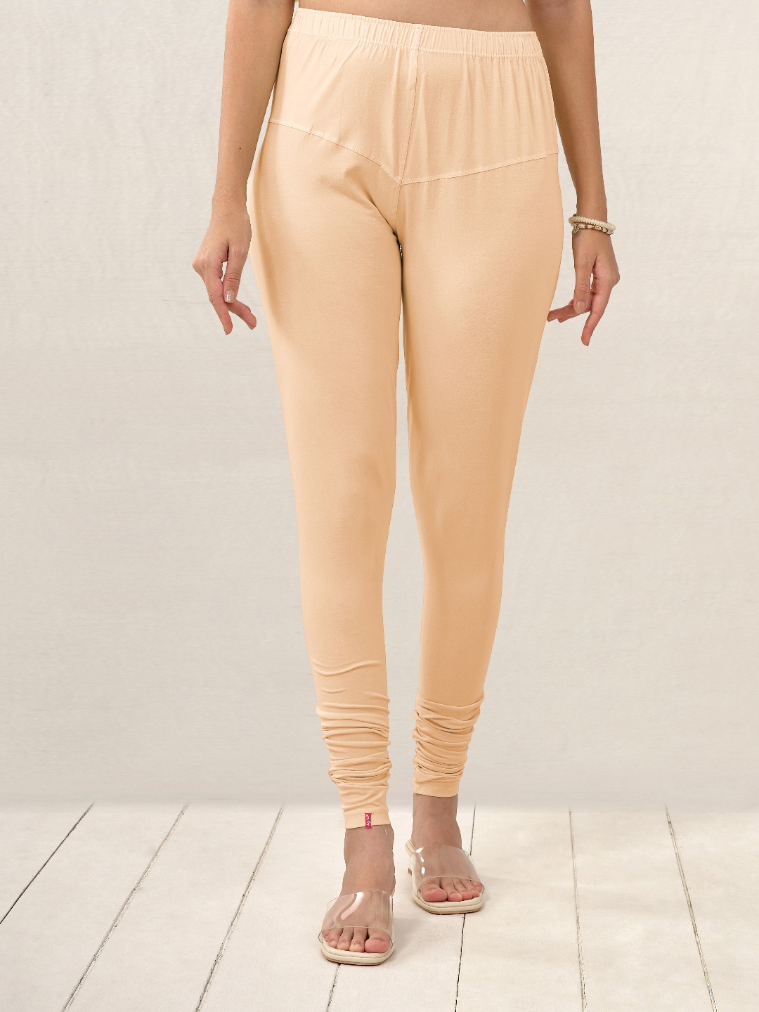 

LYRA Women Cream Solid Churidar Length Leggings