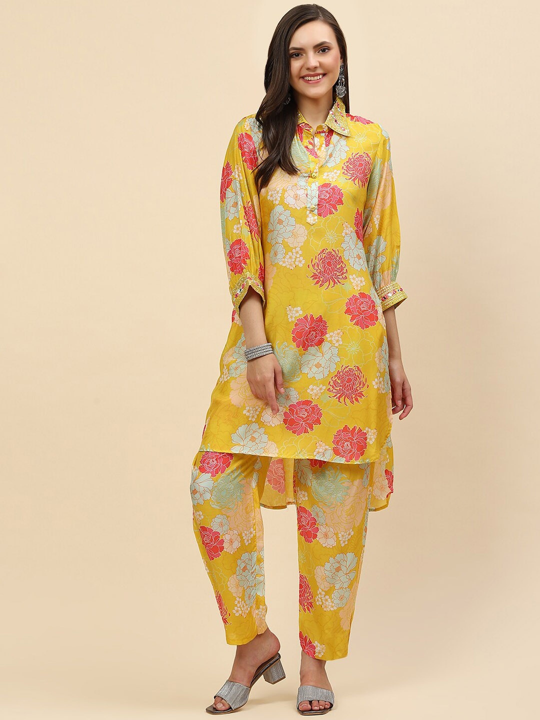 

Meena Bazaar Women Yellow Floral Printed Mirror Work Kurta with Trousers