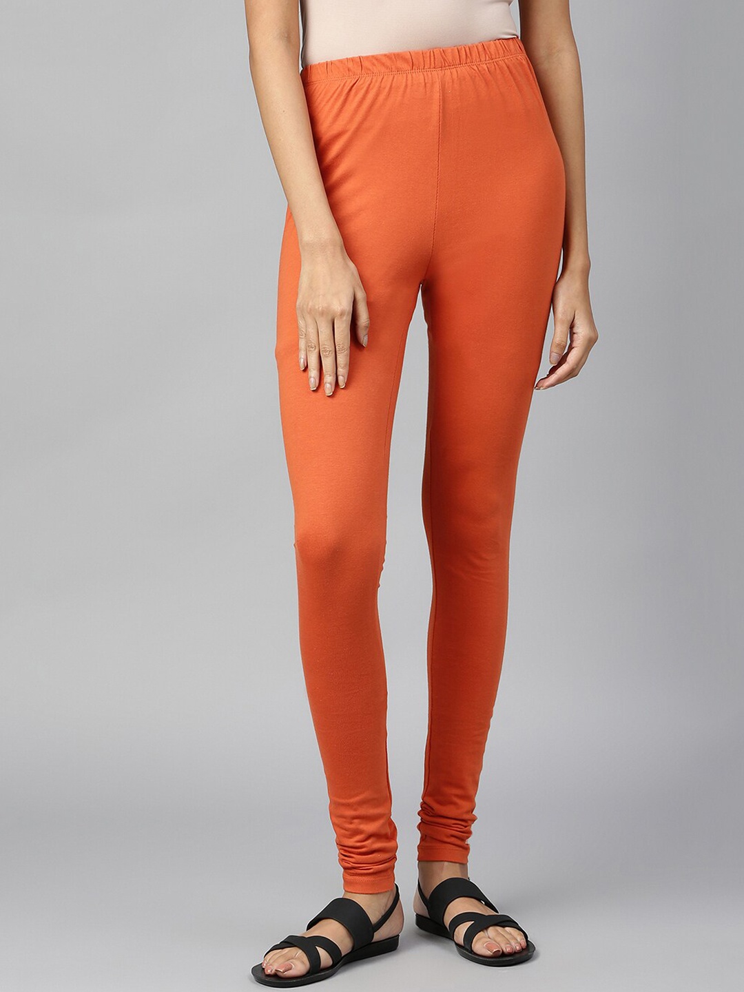 

elleven Women Solid Churidar-Length Leggings, Orange