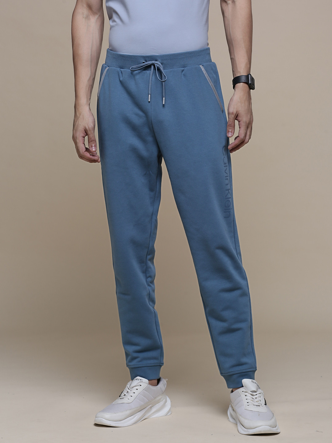 

Calvin Klein Jeans Men Solid Knitted Jogger Track Pants with Drawstring Closure, Blue