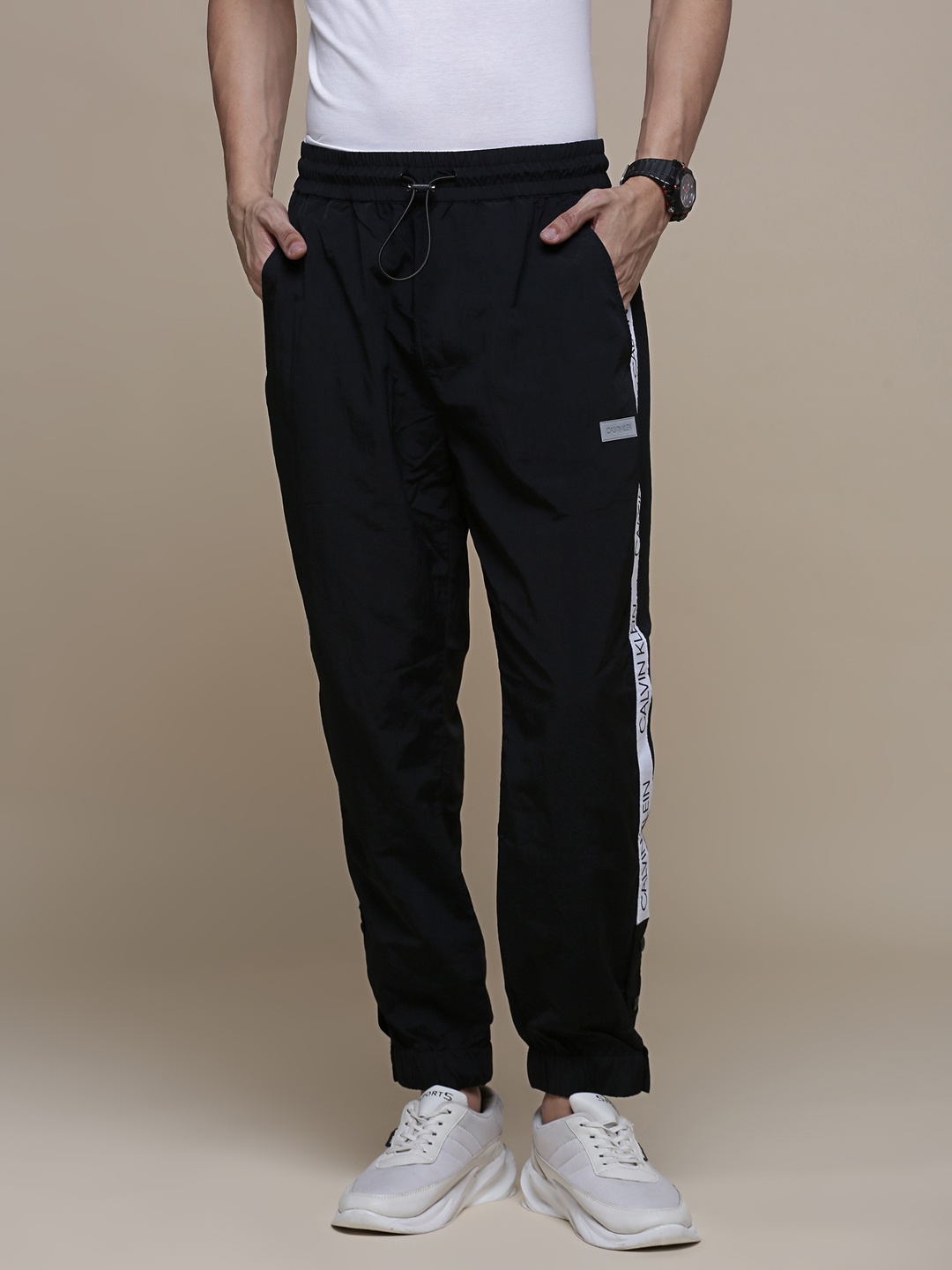 

Calvin Klein Jeans Men Black Regular Fit Mid-Rise Woven Joggers With Side Taping Detail