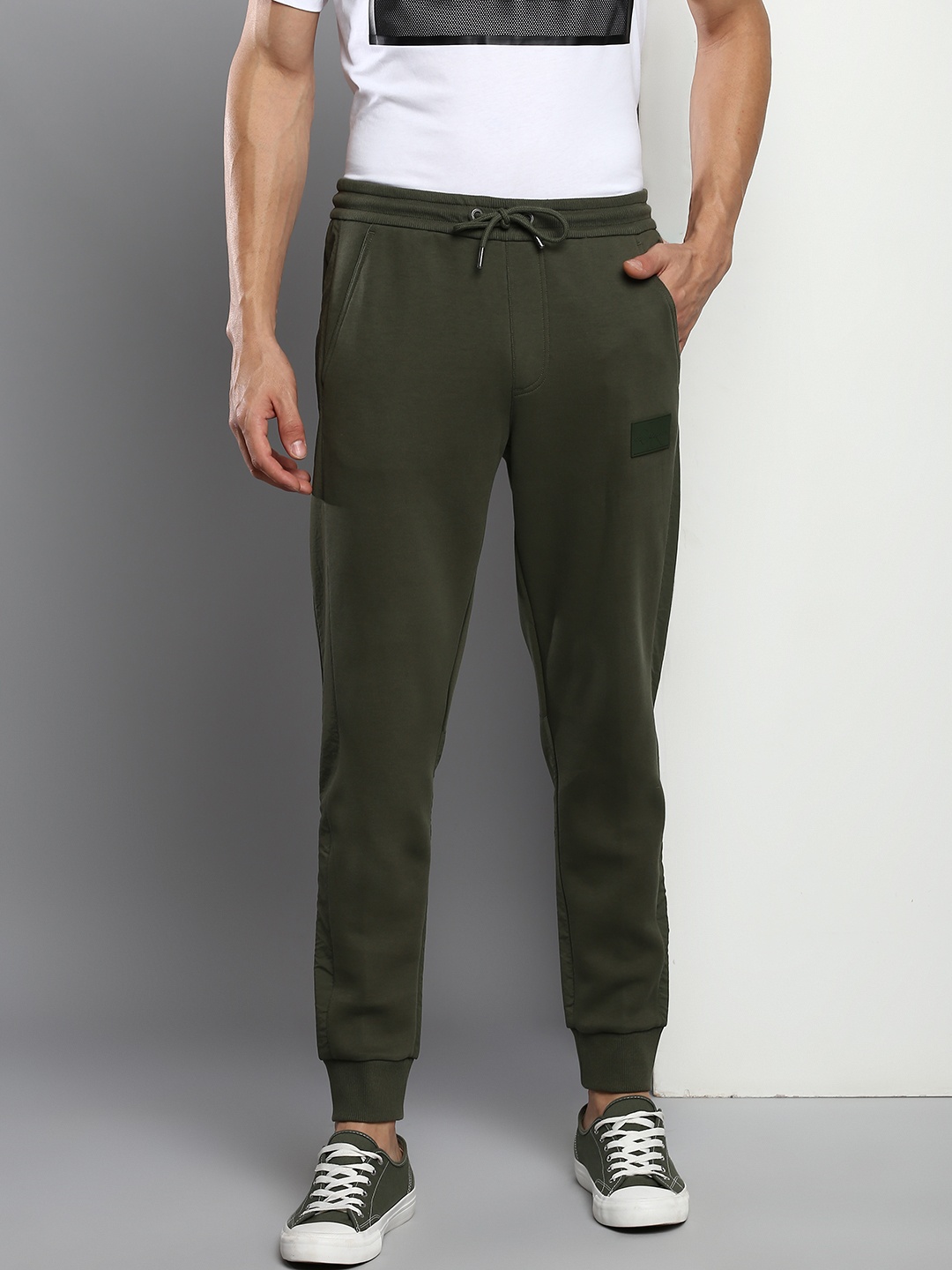 

Calvin Klein Jeans Men Olive Green Solid Regular Fit Joggers