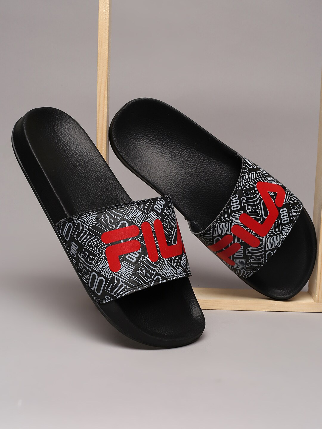 

FILA Men Black & Red Printed Rubber Sliders