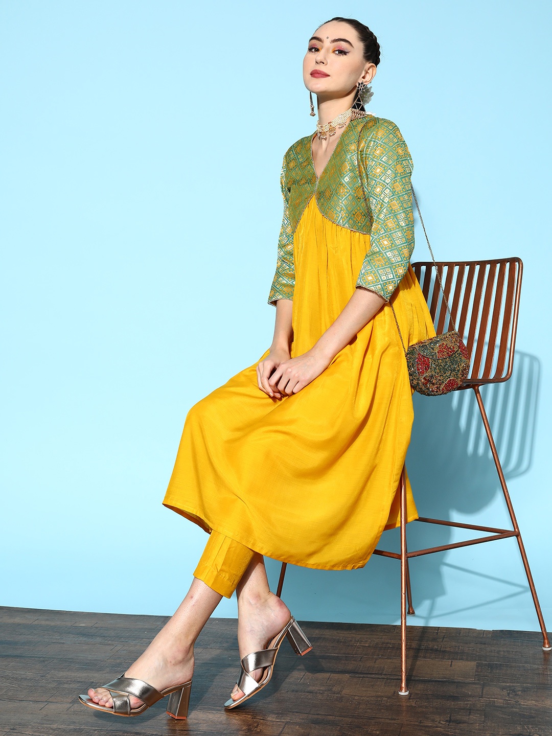 

Inddus Women Mustard Yellow Pleated Kurta with Trousers