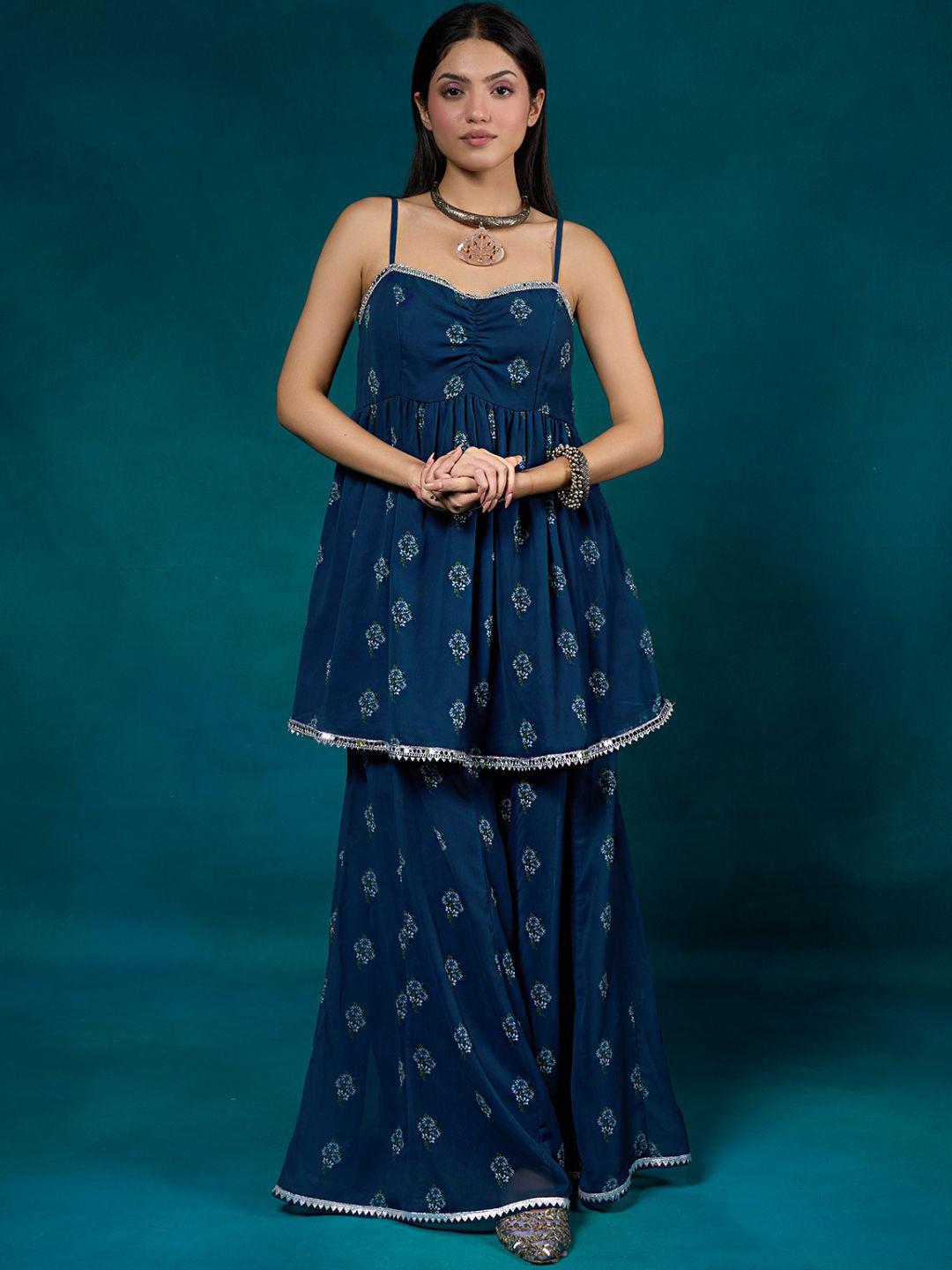 

Alaya By Stage3 Women Blue & White Floral Printed Flared Georgette Palazzos