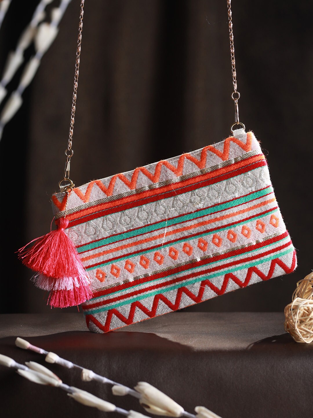 

Priyaasi Orange Sling Bag with Tasselled