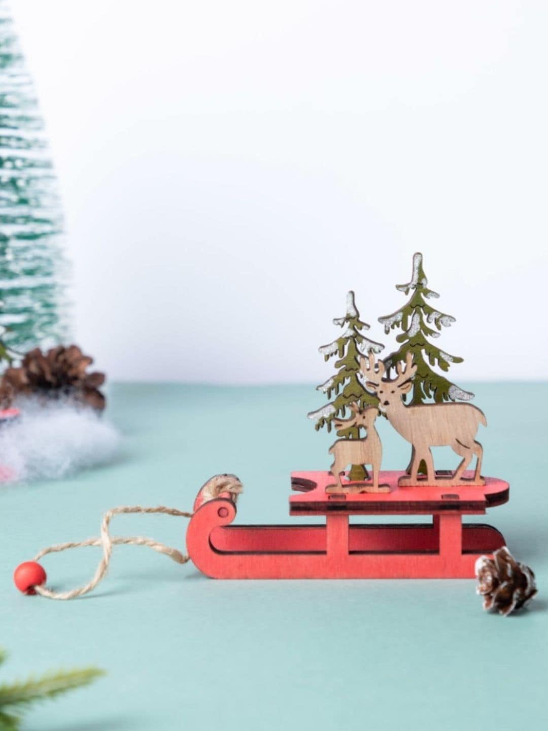 

Nestasia Red & Green Solid Reindeer Sleigh Wooden Showpieces