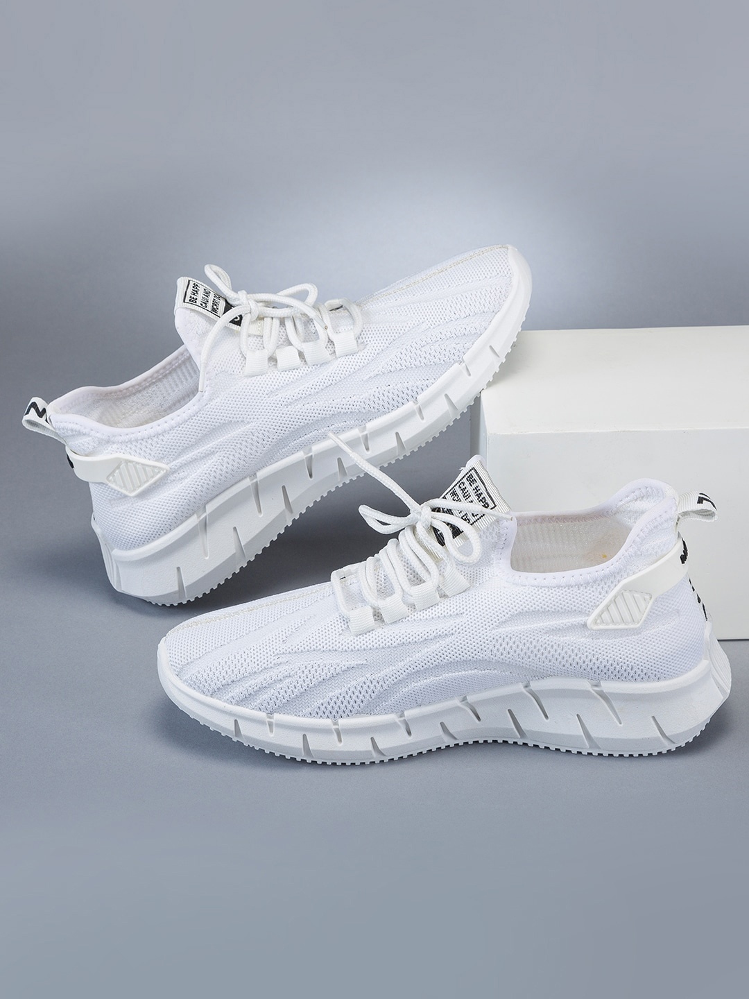 

RapidBox Men White Textured Sneakers