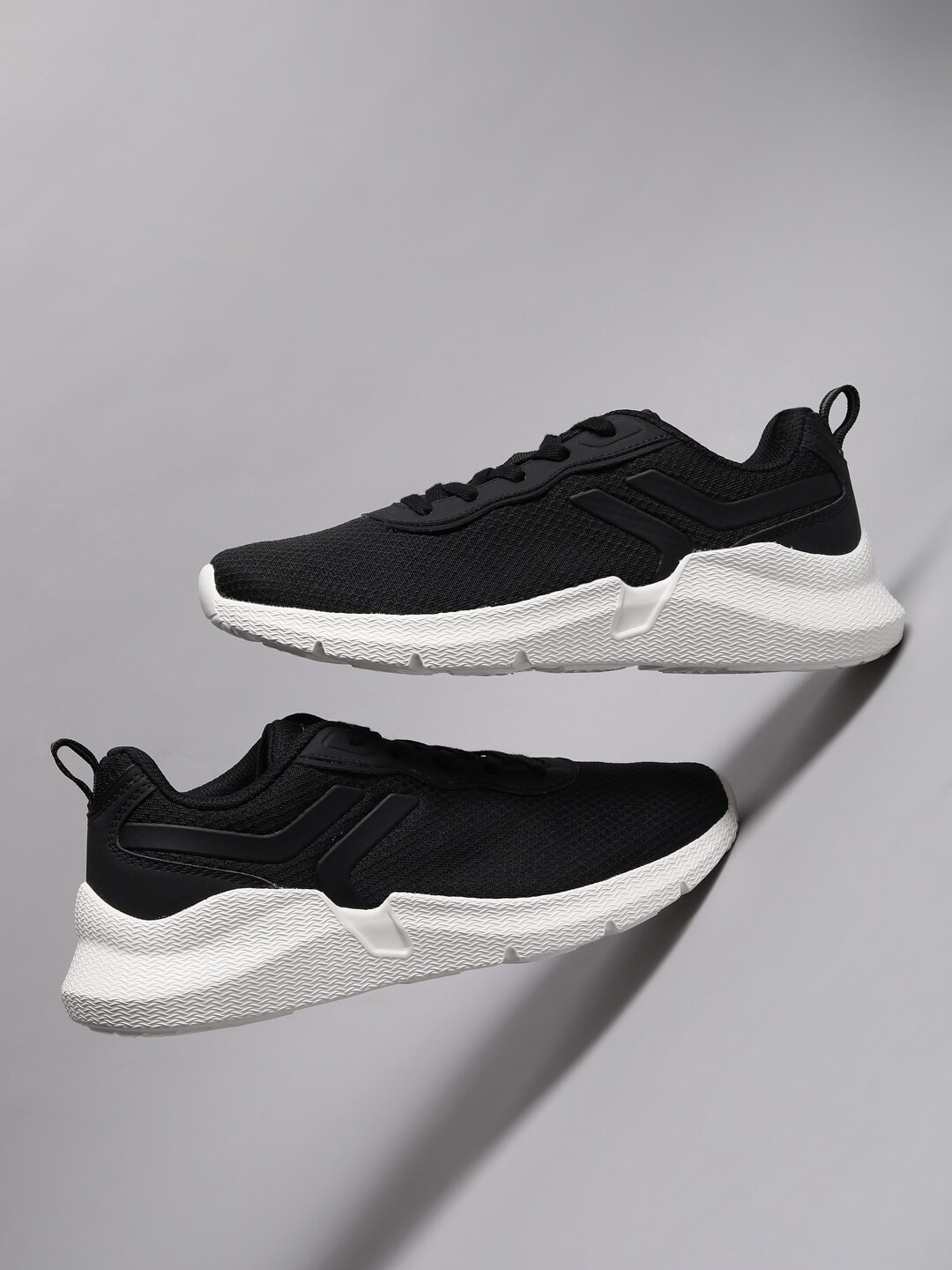 

Xtep Women Black Woven Design Sneakers