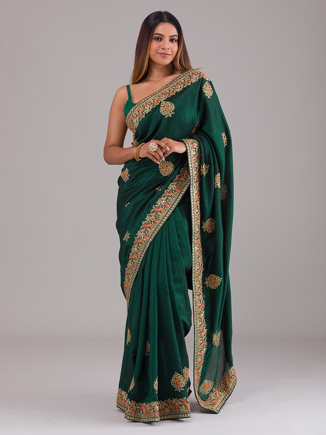 

Koskii Green & Gold-Toned Ethnic Motifs Zari Art Silk Saree