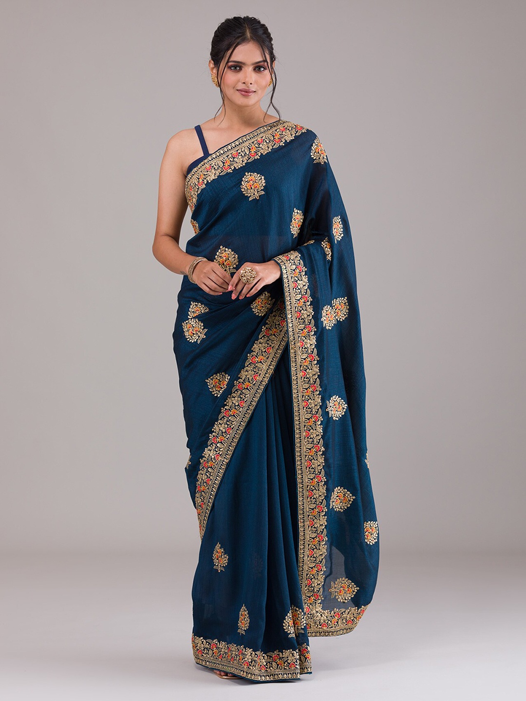 

Koskii Blue & Gold-Toned Ethnic Motifs Beads and Stones Art Silk Saree