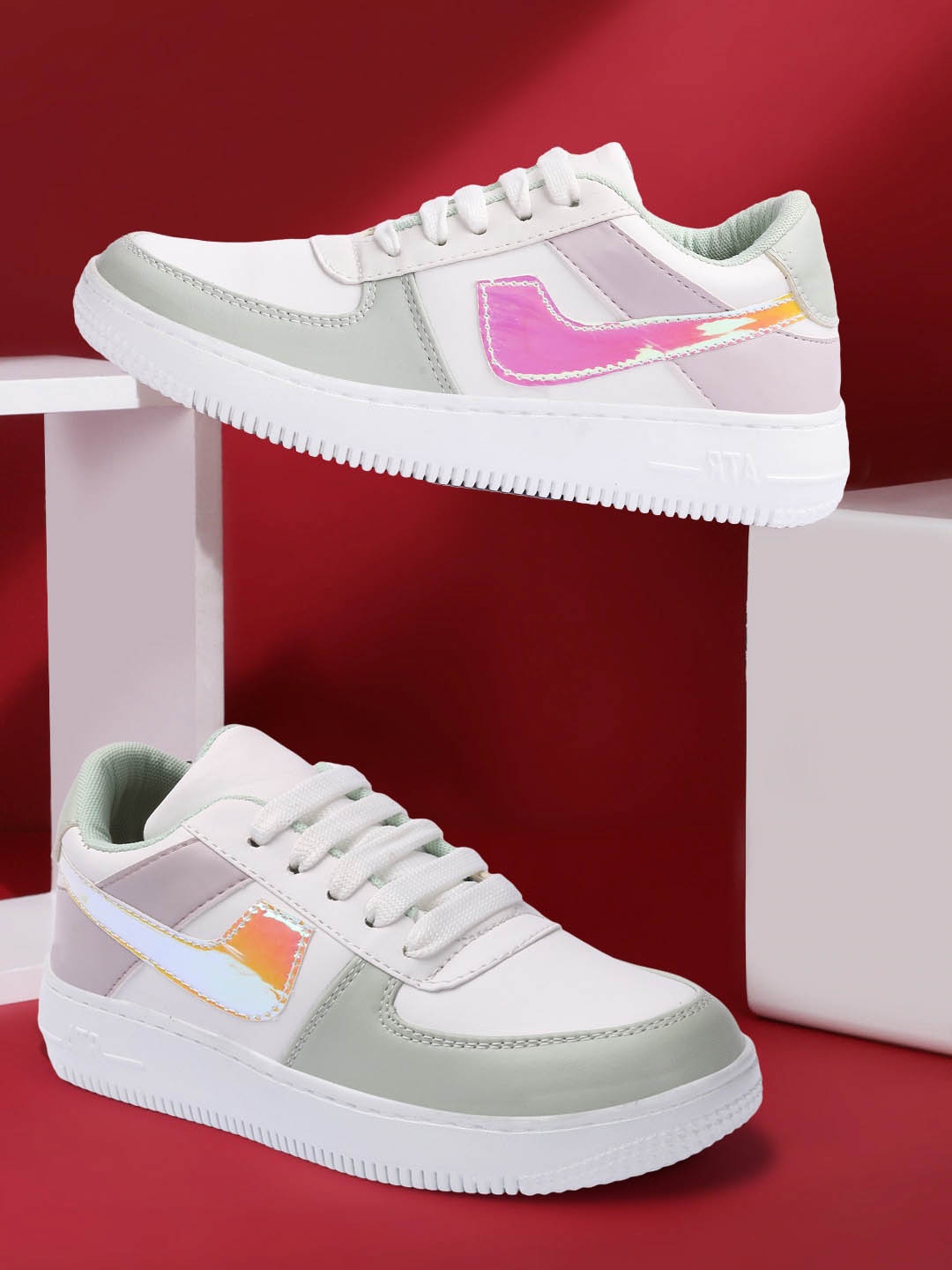

Elibolz Women White Colourblocked Sneakers