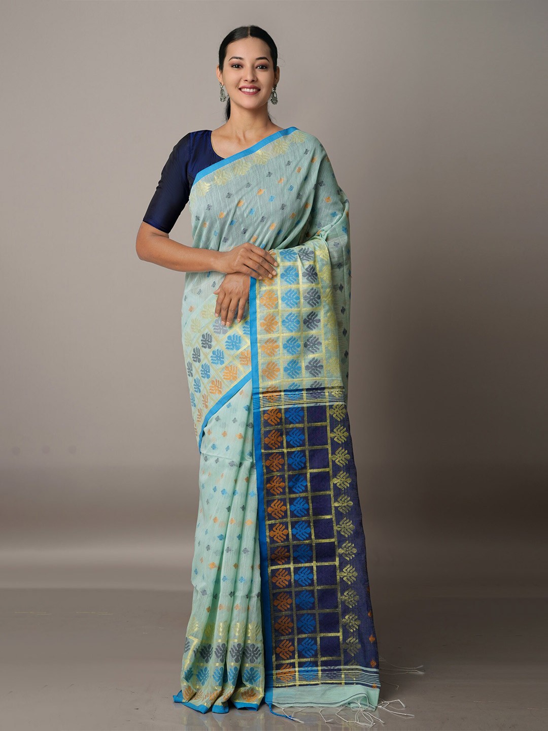 

Unnati Silks Blue & Navy Blue Ethnic Motifs Zari Silk Cotton Jamdani Saree