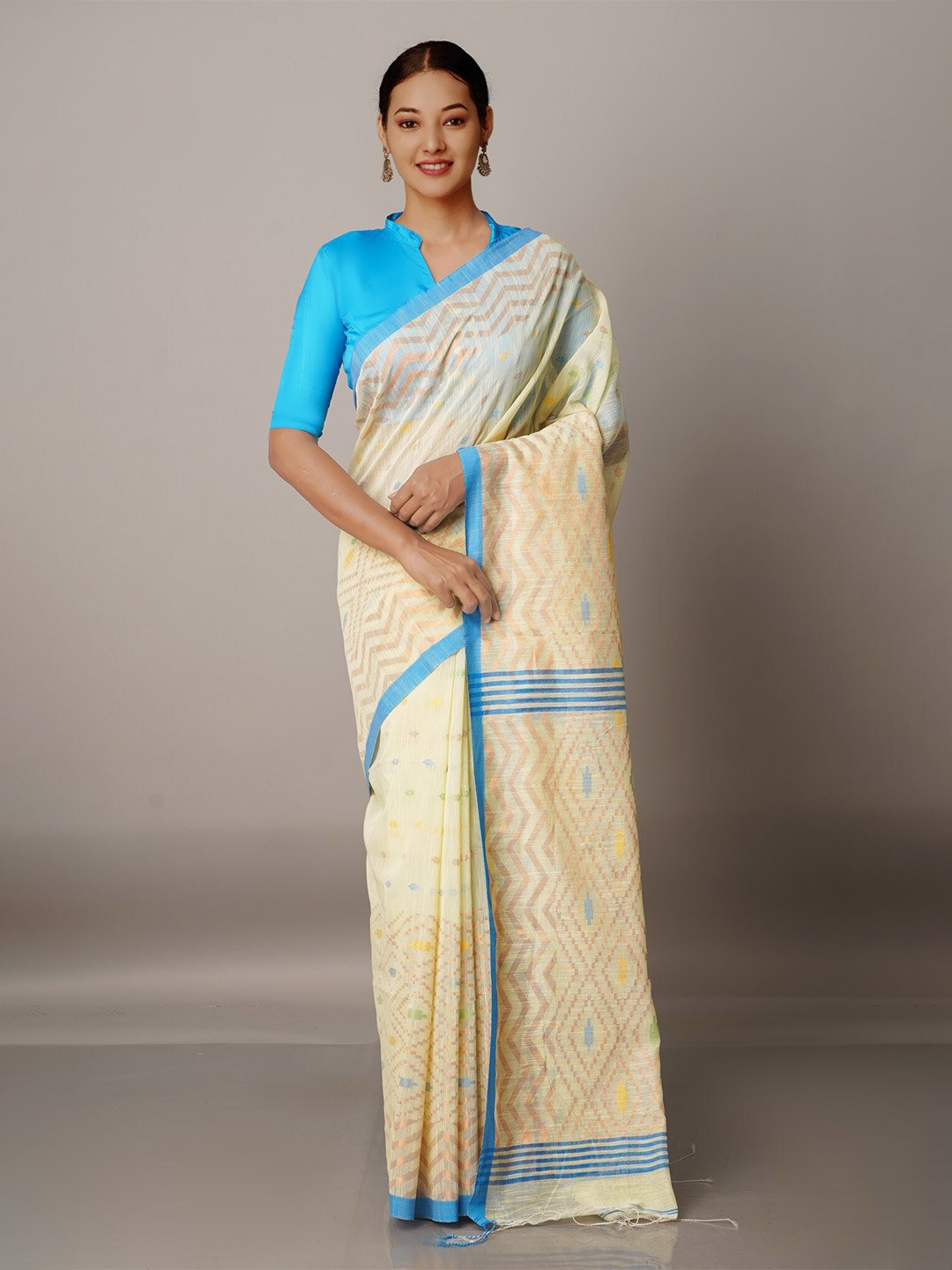 

Unnati Silks Beige & Blue Woven Design Zari Silk Cotton Jamdani Saree