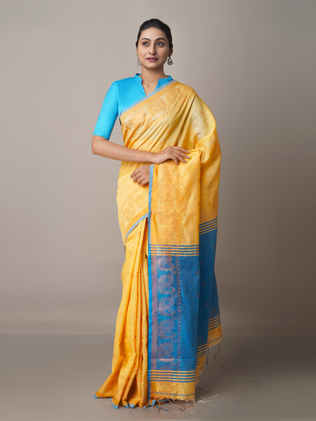 

Unnati Silks Tan & Blue Ethnic Motifs Linen Blend Jamdani Saree