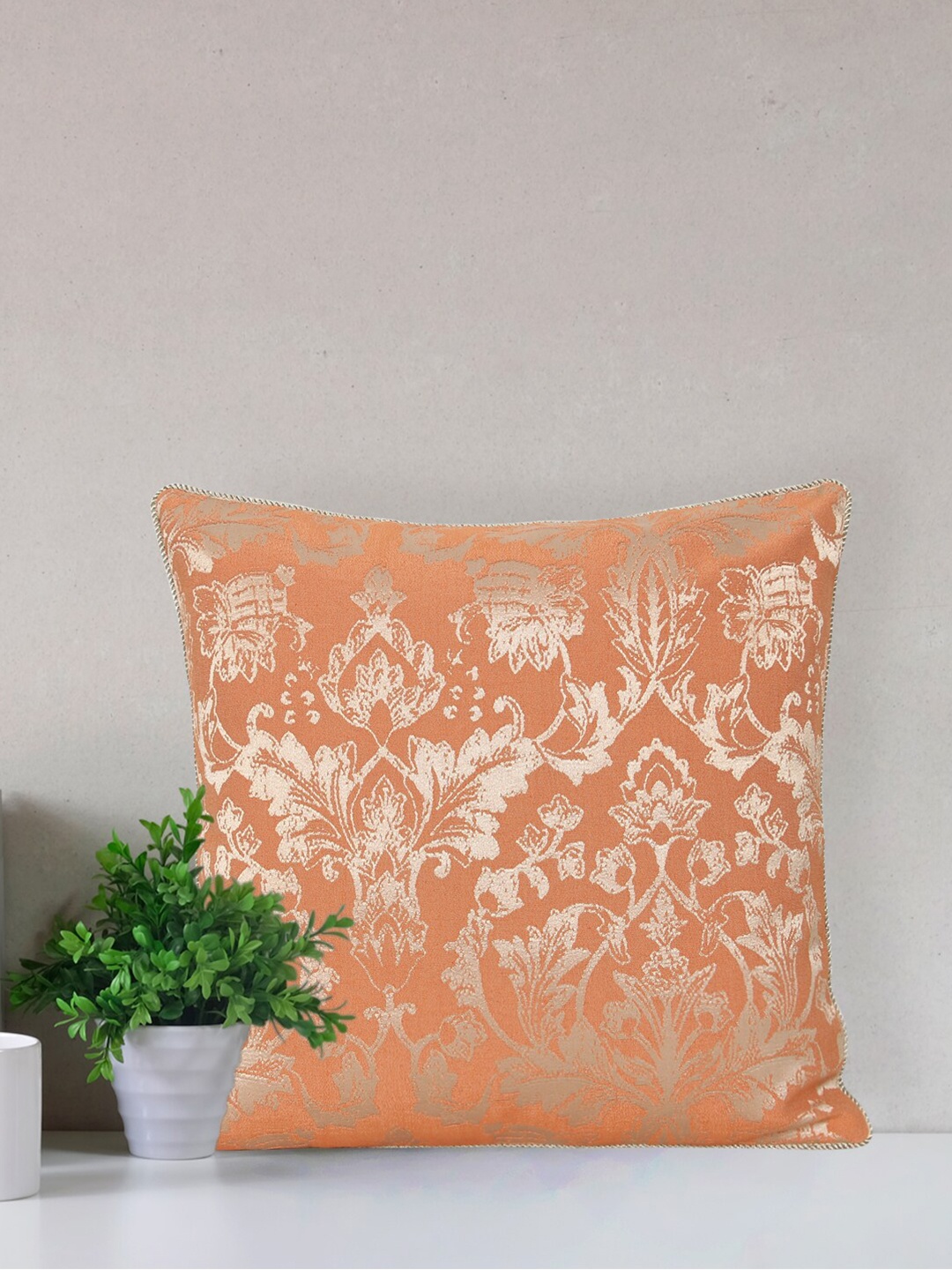

Home Orange & Silver-Toned Printed Self Design Square Cushion Covers