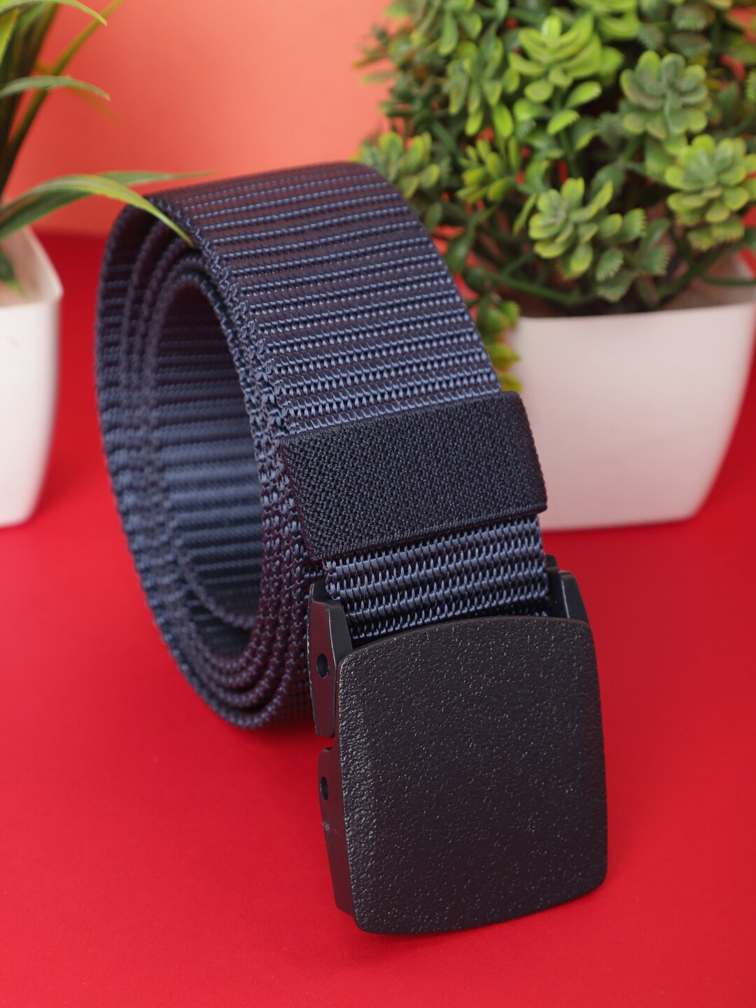 

The Mini NEEDLE Men Blue & Black Textured Belt Secured with a slider buckle closure