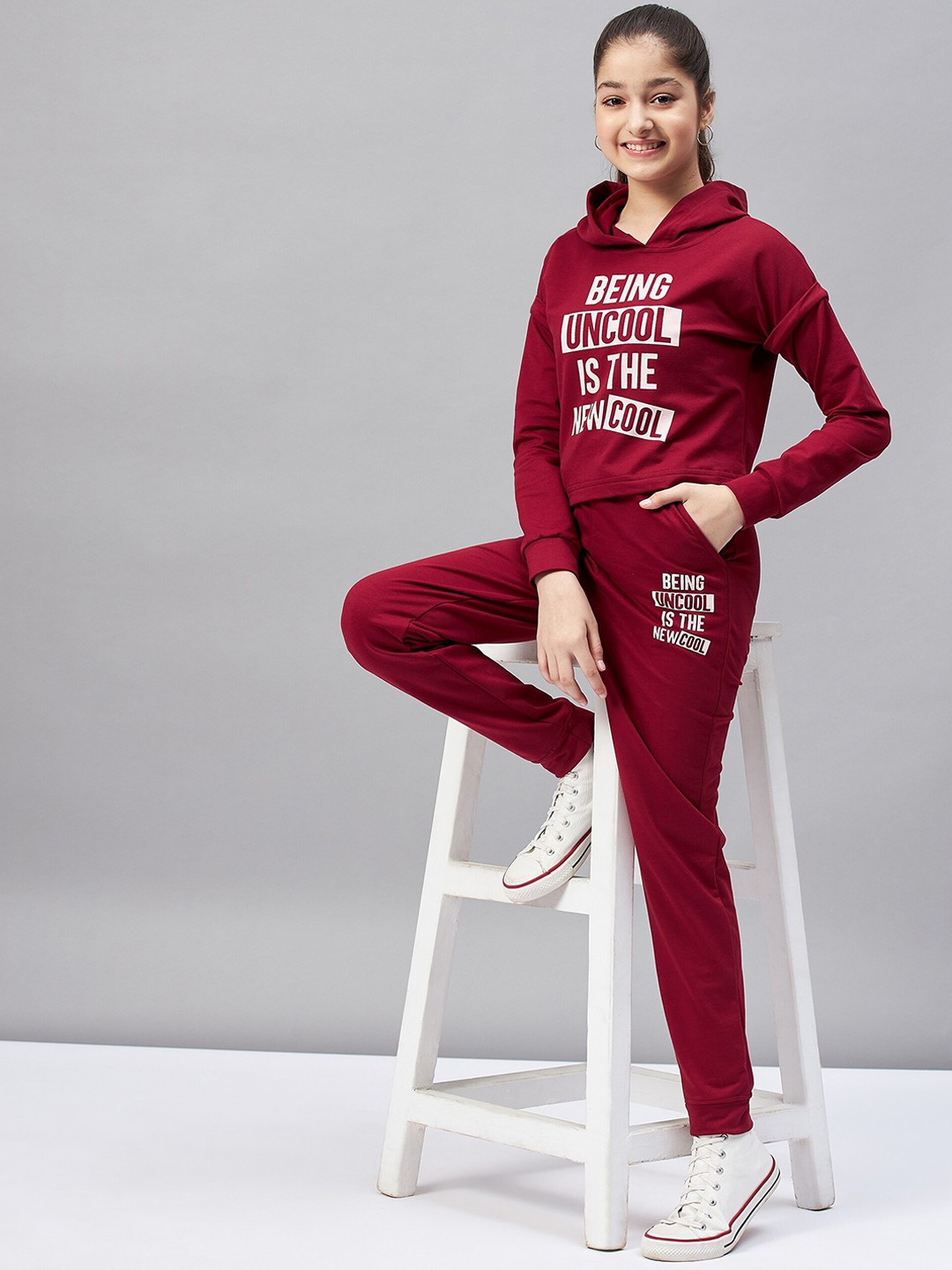 

Stylo Bug Girls Maroon Typography Printed Tracksuits