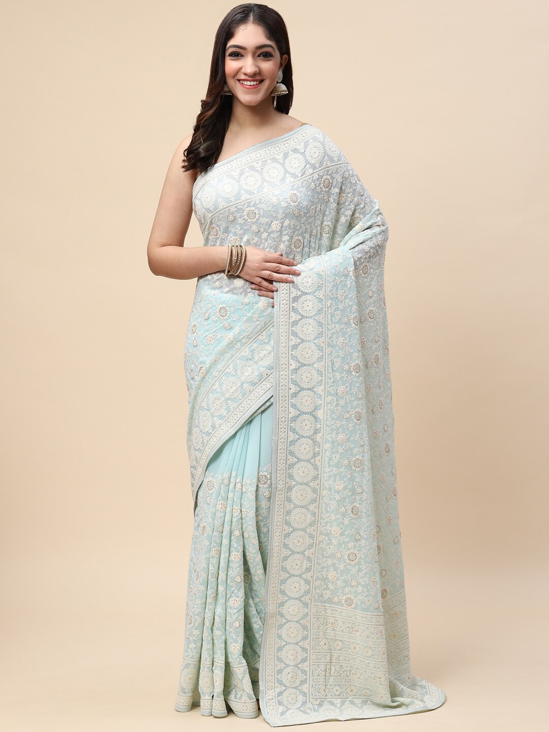 

Meena Bazaar Sea Green & White Floral Sequinned Saree