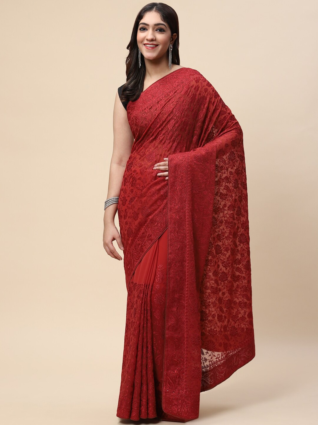 

Meena Bazaar Rust Embellished Embroidered Saree