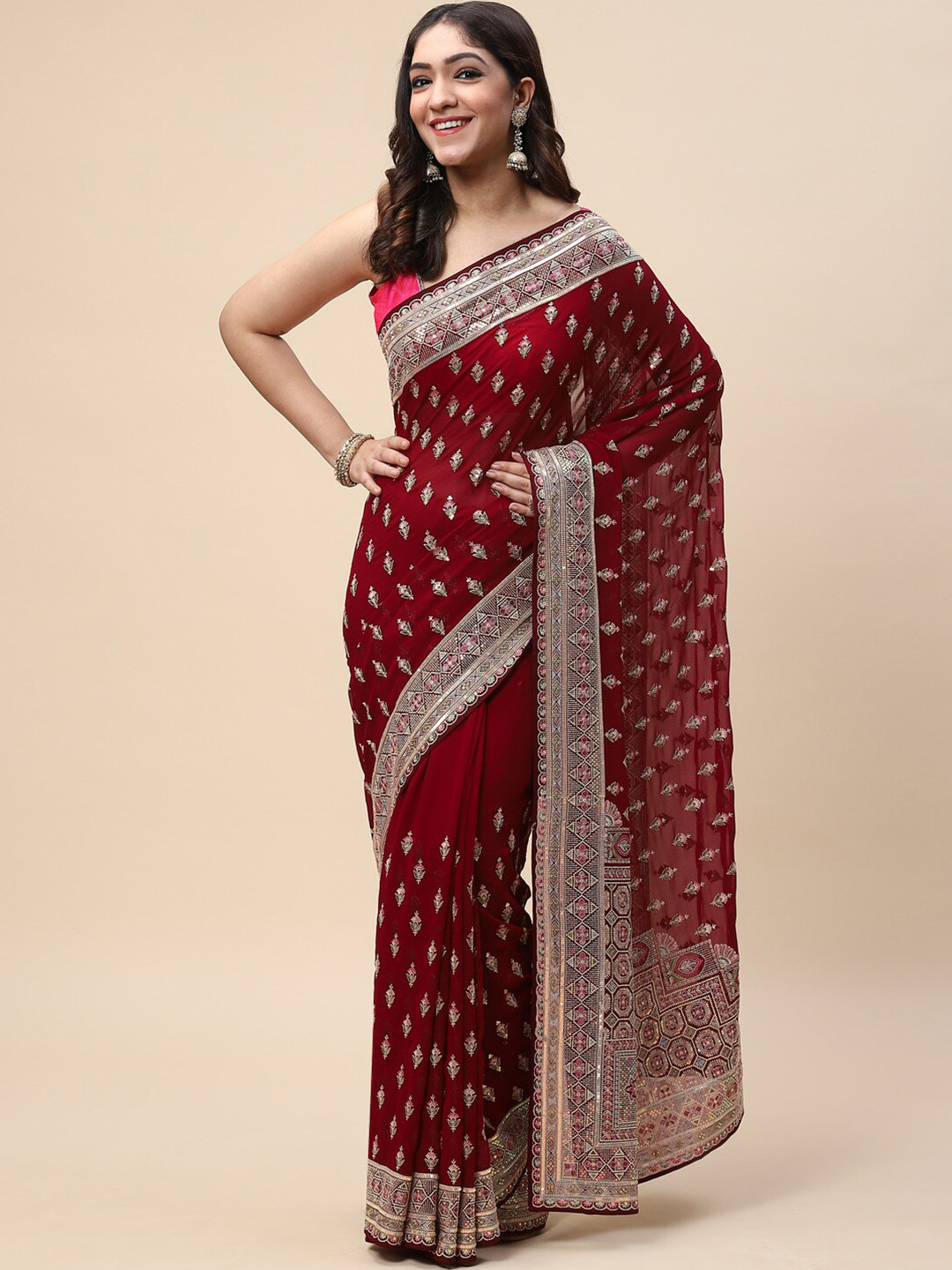 

Meena Bazaar Burgundy & Gold-Toned Ethnic Motifs Embroidered Saree
