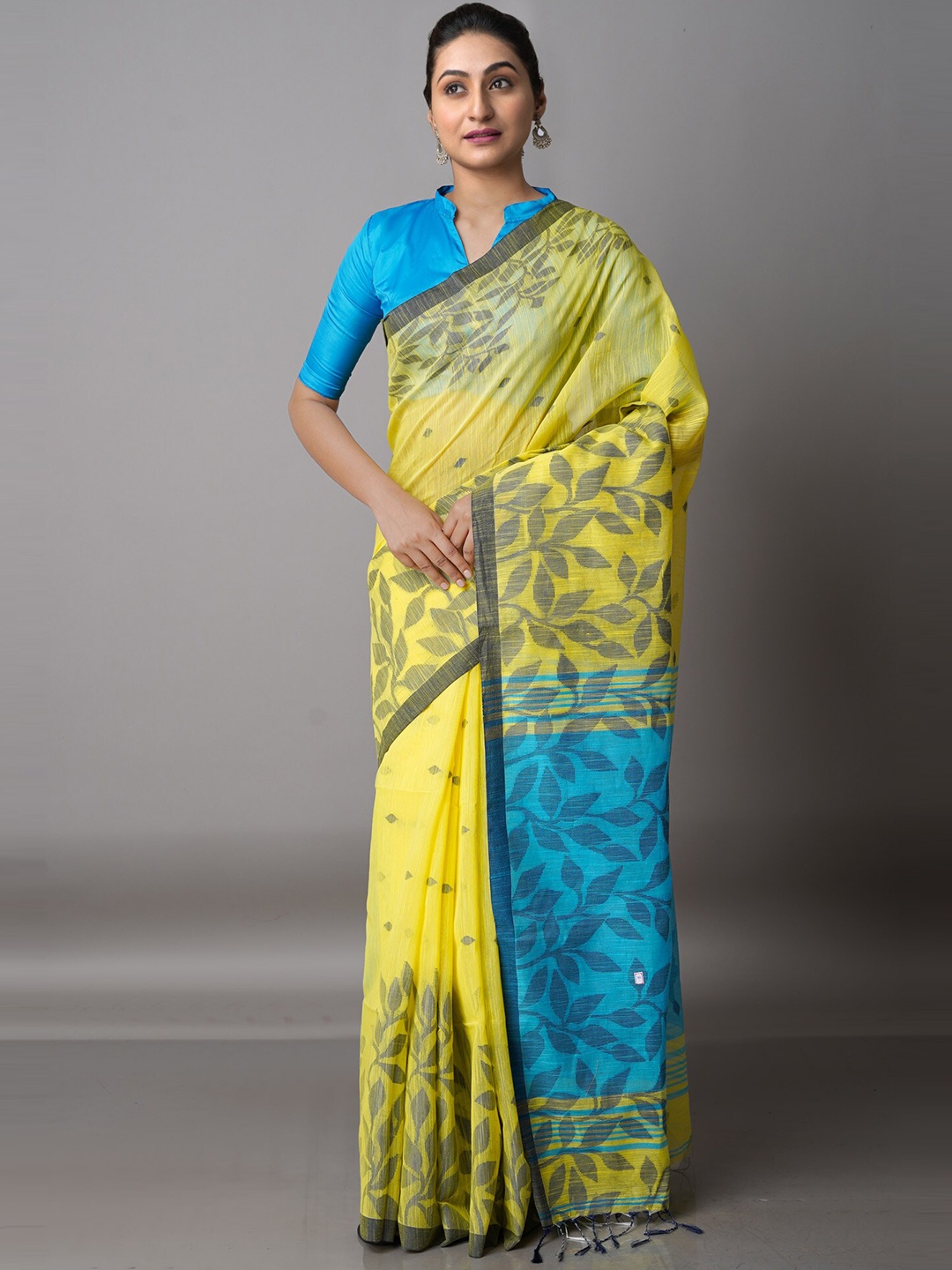 

Unnati Silks Yellow & Blue Floral Silk Cotton Jamdani Saree