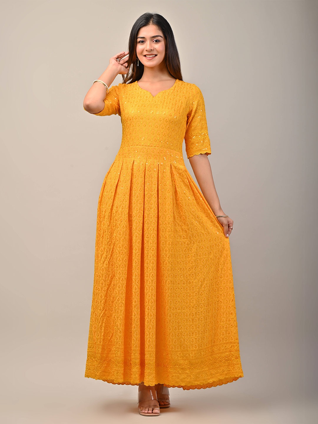

Meeranshi Women Mustard Yellow Ethnic Motifs Embroidered Pleated Maxi Dress