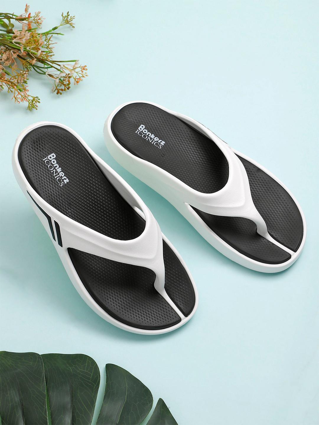 

ICONICS Women White & Black Croslite Thong Flip-Flops
