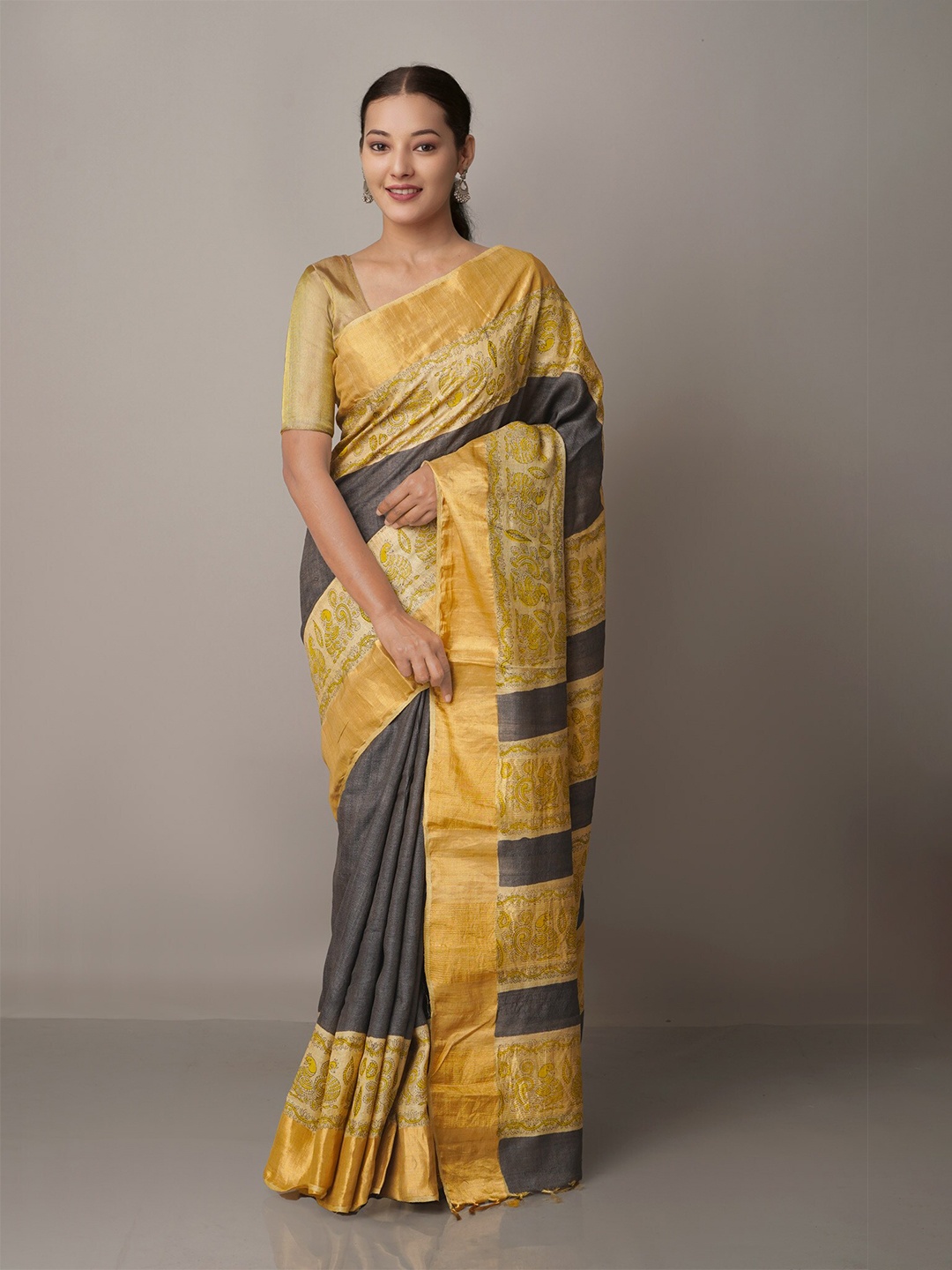 

Unnati Silks Black & Yellow Ethnic Motifs Zari Pure Silk Tussar Saree