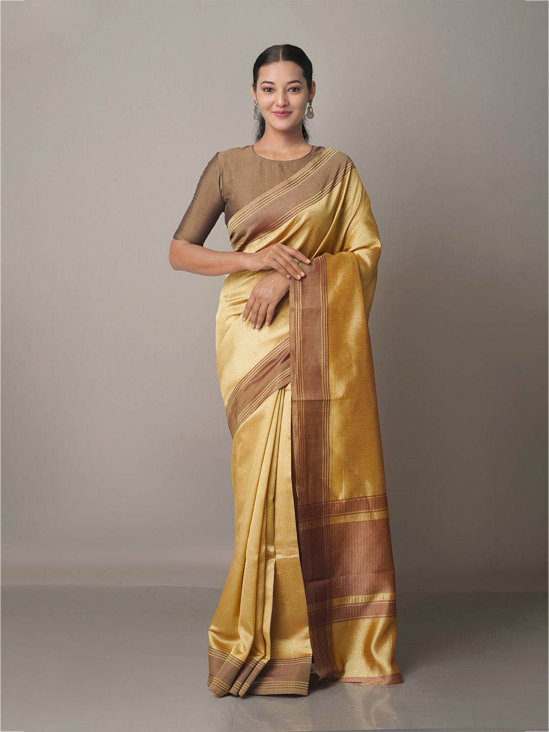 

Unnati Silks Brown & Mustard Woven Design Art Silk Patola Saree