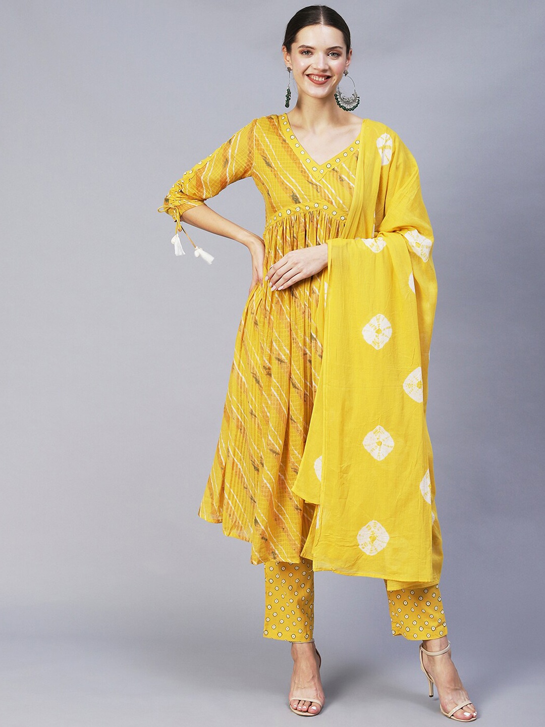 

FASHOR Women Yellow Printed Pleated Kurta with Trousers & With Dupatta