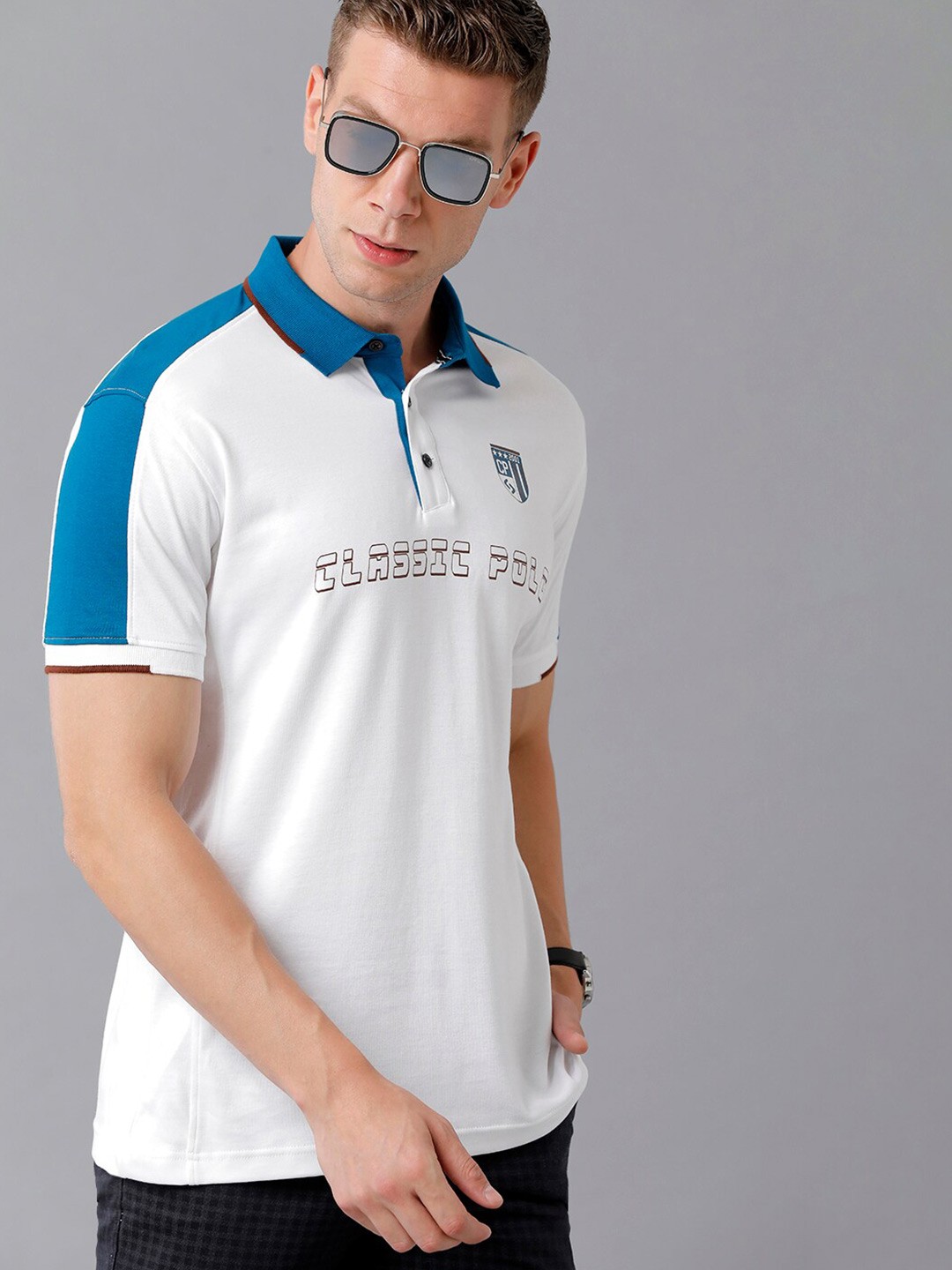

Classic Polo Men White & Blue Typography Polo Collar Slim Fit Cotton T-shirt