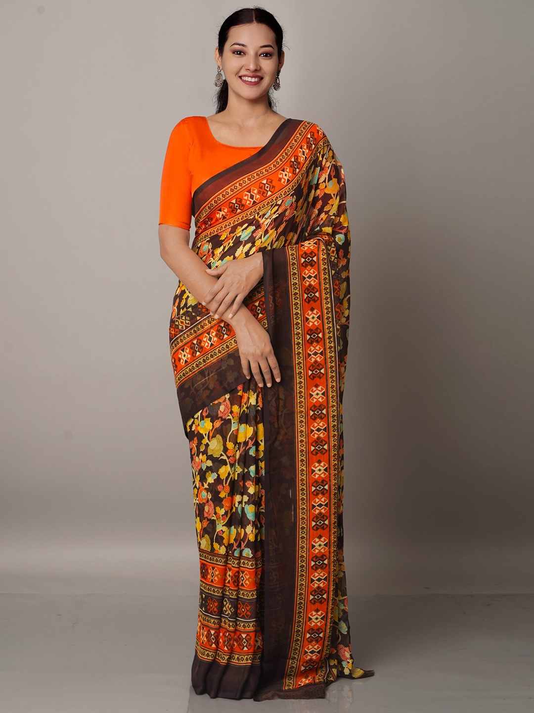 

Unnati Silks Black & Orange Floral Printed Block Print Saree