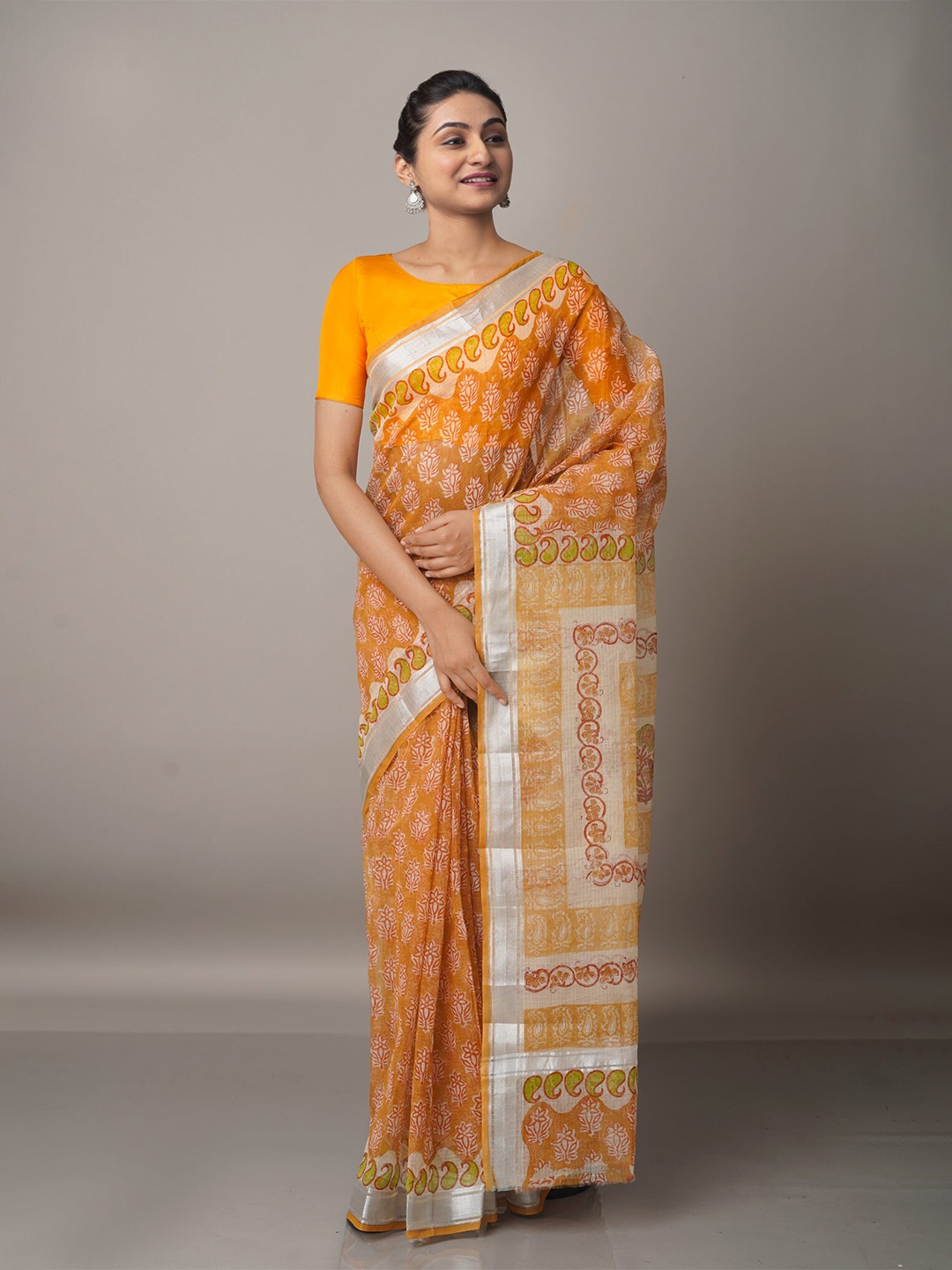 

Unnati Silks Orange & Silver-Toned Ethnic Motifs Zari Pure Cotton Kota Saree