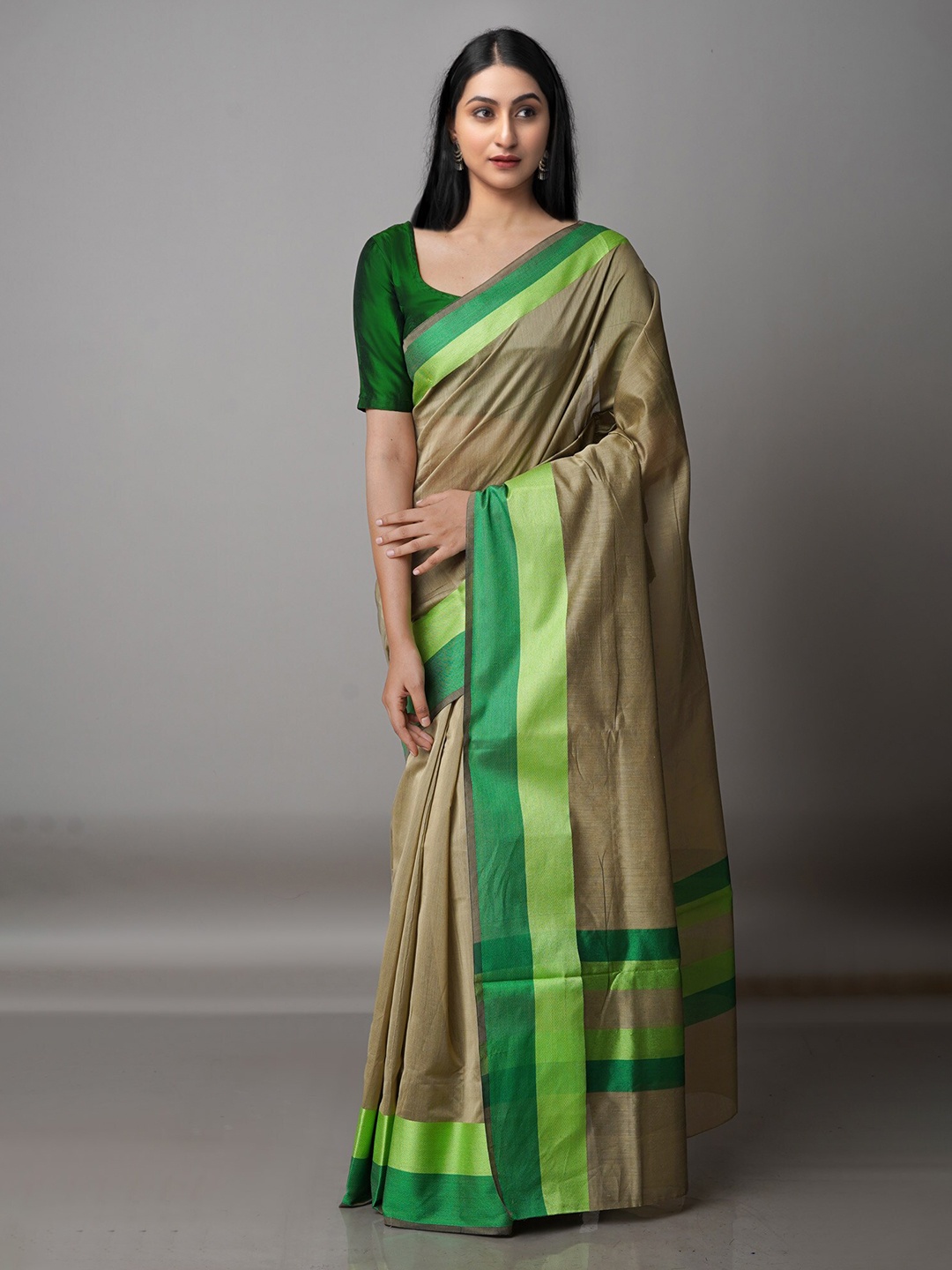 

Unnati Silks Bronze-Toned & Green Silk Cotton Bhagalpuri Saree